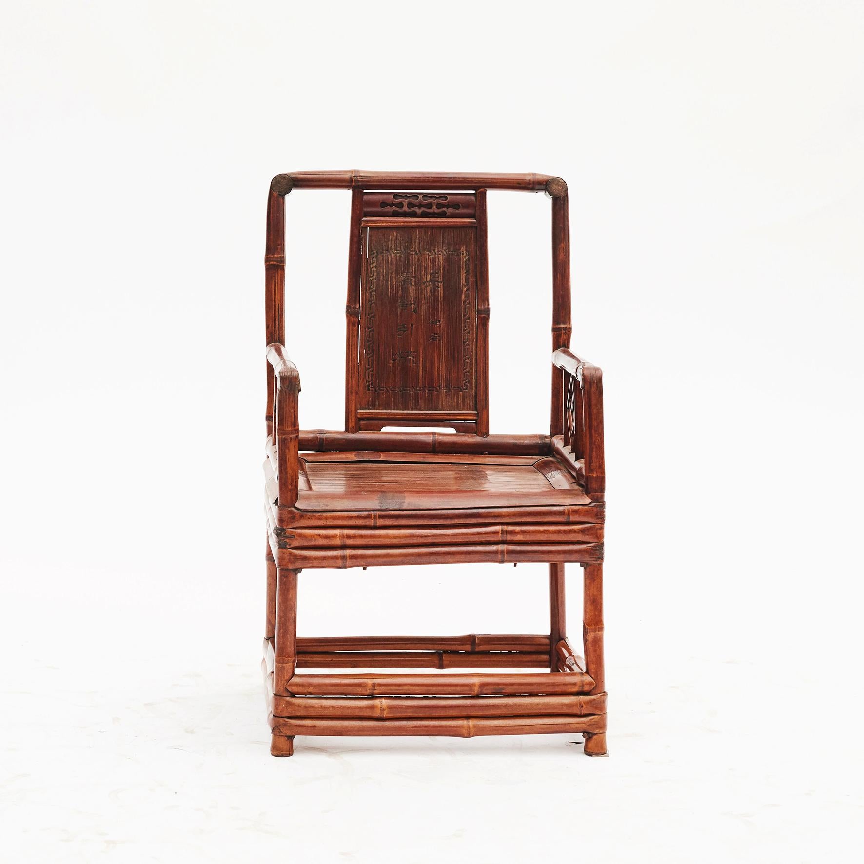 Pair of Chinese bamboo chairs each with inset rectangular panel with calligraphy lettering, China, 1860-1880.
Original condition with a rich, warm patina.
Sold as a pair.