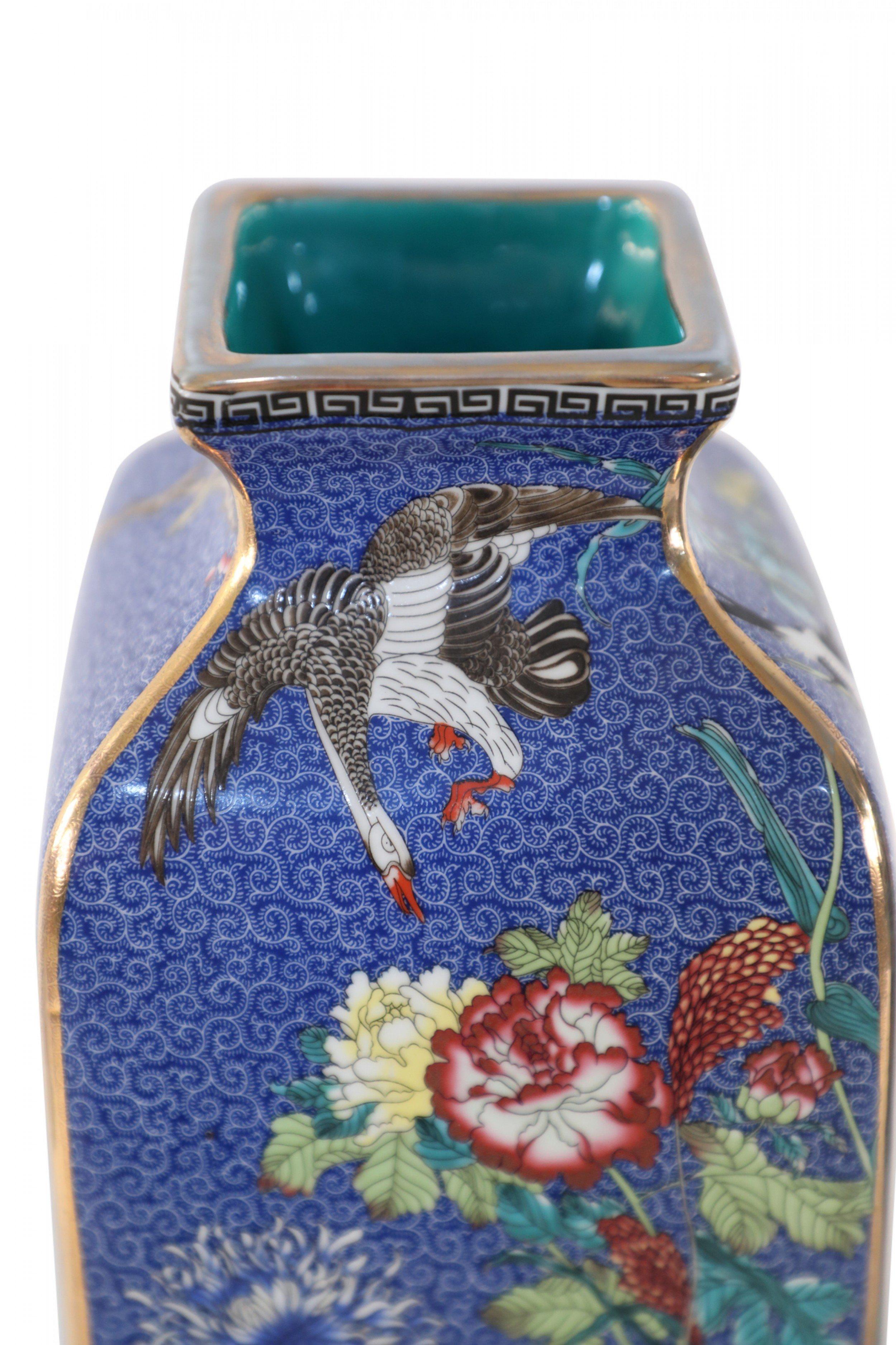 Pair of Chinese Qing Dynasty Qianlong Period (18th Century) blue porcelain sleeve vases, decorated with birds and butterflies amid colorful florals and a Greek key pattern along the tops and bases (date mark on bottom) (Priced as pair).
 