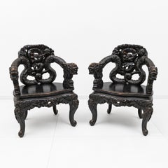 Pair of Chinese Qing Dynasty Carved Dragon Armchairs, Ebonized Hardwood, 19th