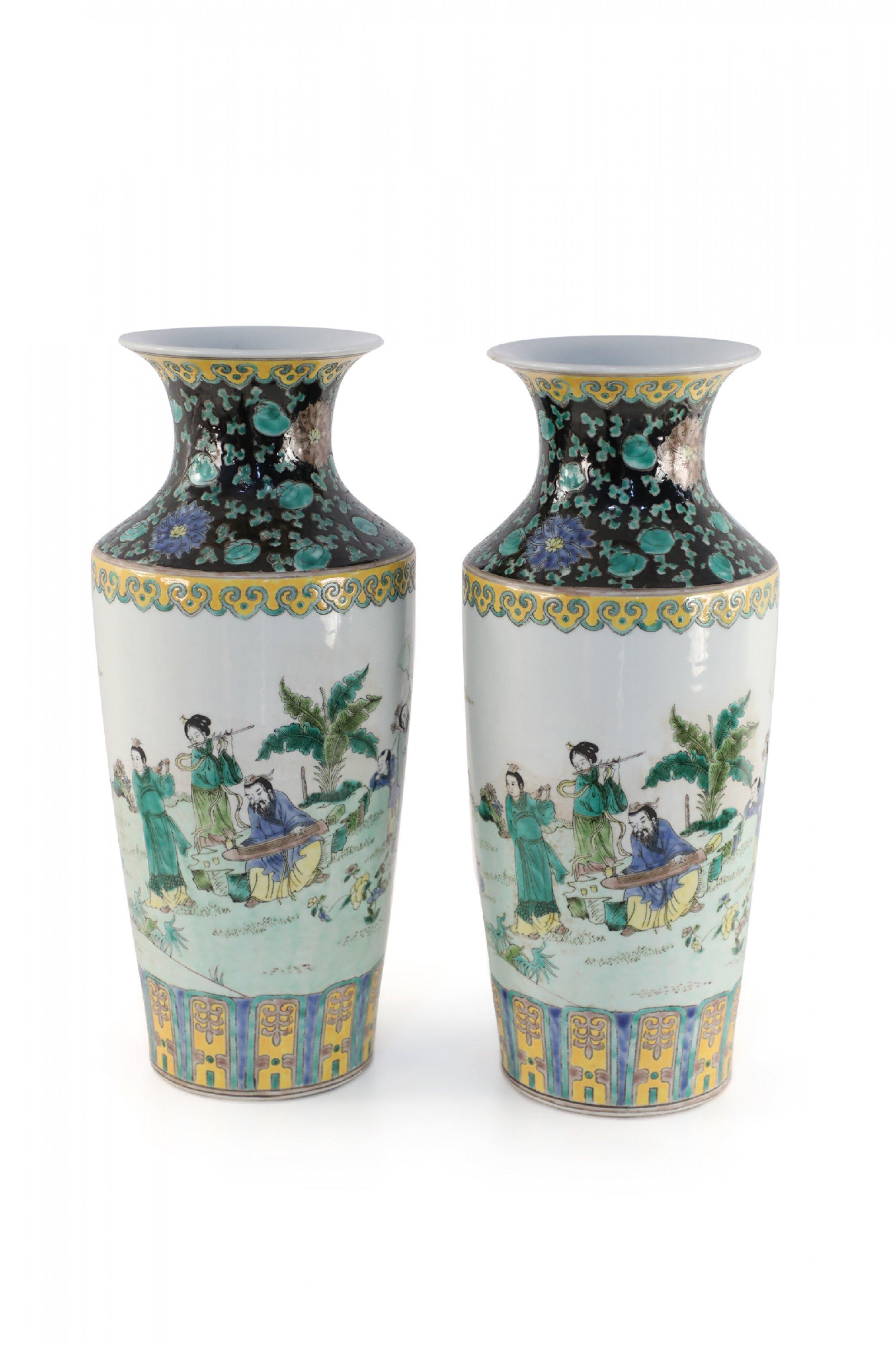 Pair of Chinese Qing Dynasty Kangxi Period (late 17th to early 18th century) sleeve vases depicting a garden setting on a celadon background, with designs at the top and base in Jingdezhen sancai glaze color revival tones. (has date mark) (priced as