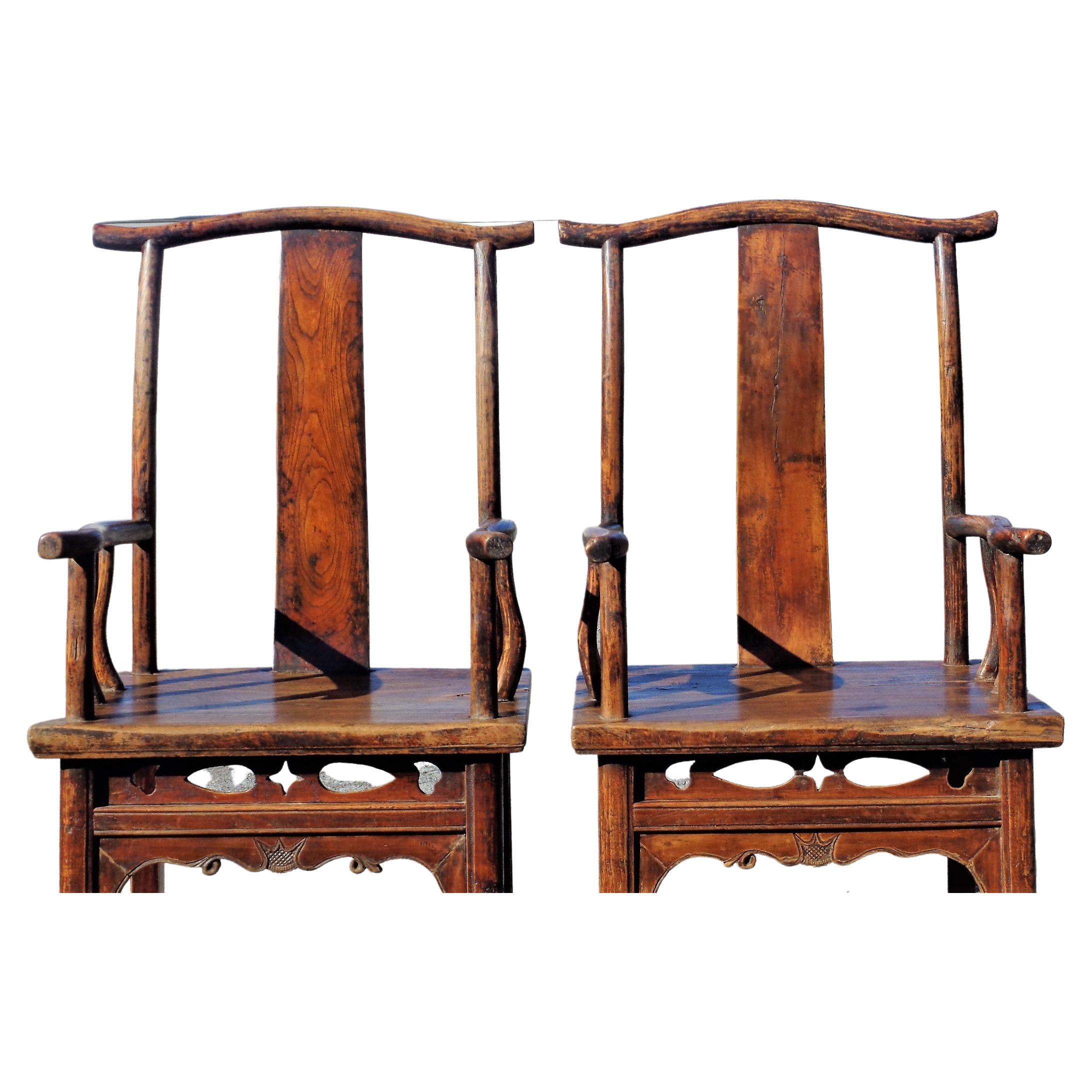 Pair of Chinese Qing dynasty hardwood elm yoke back armchairs ( officials hat chairs ) in beautifully aged original old surface color patina w/ well figured grain. Late 19th century. Look at all pictures and read condition report in comment section.