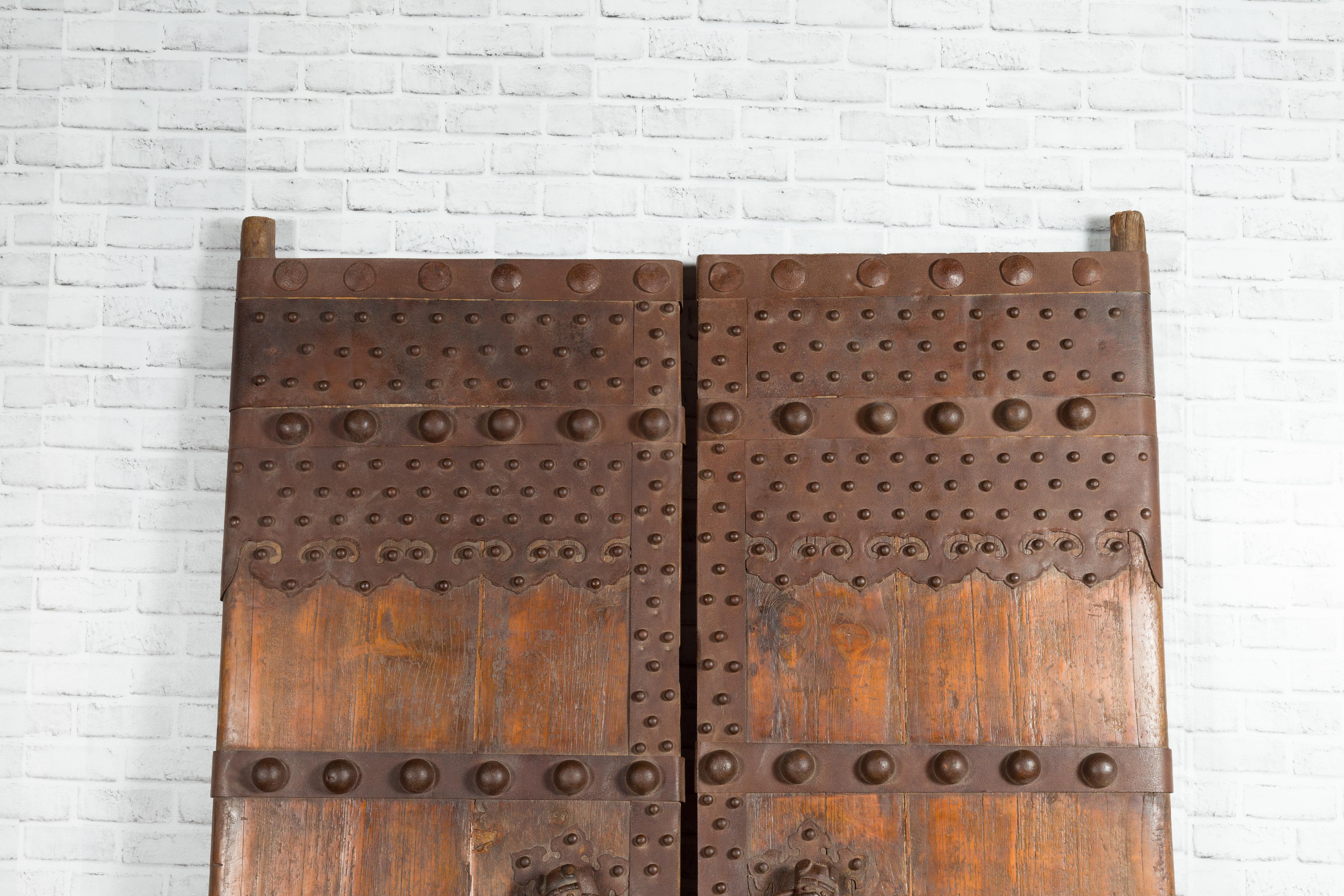19th Century Pair of Chinese Qing Dynasty Palace Doors with Iron Hardware and Dark Patina