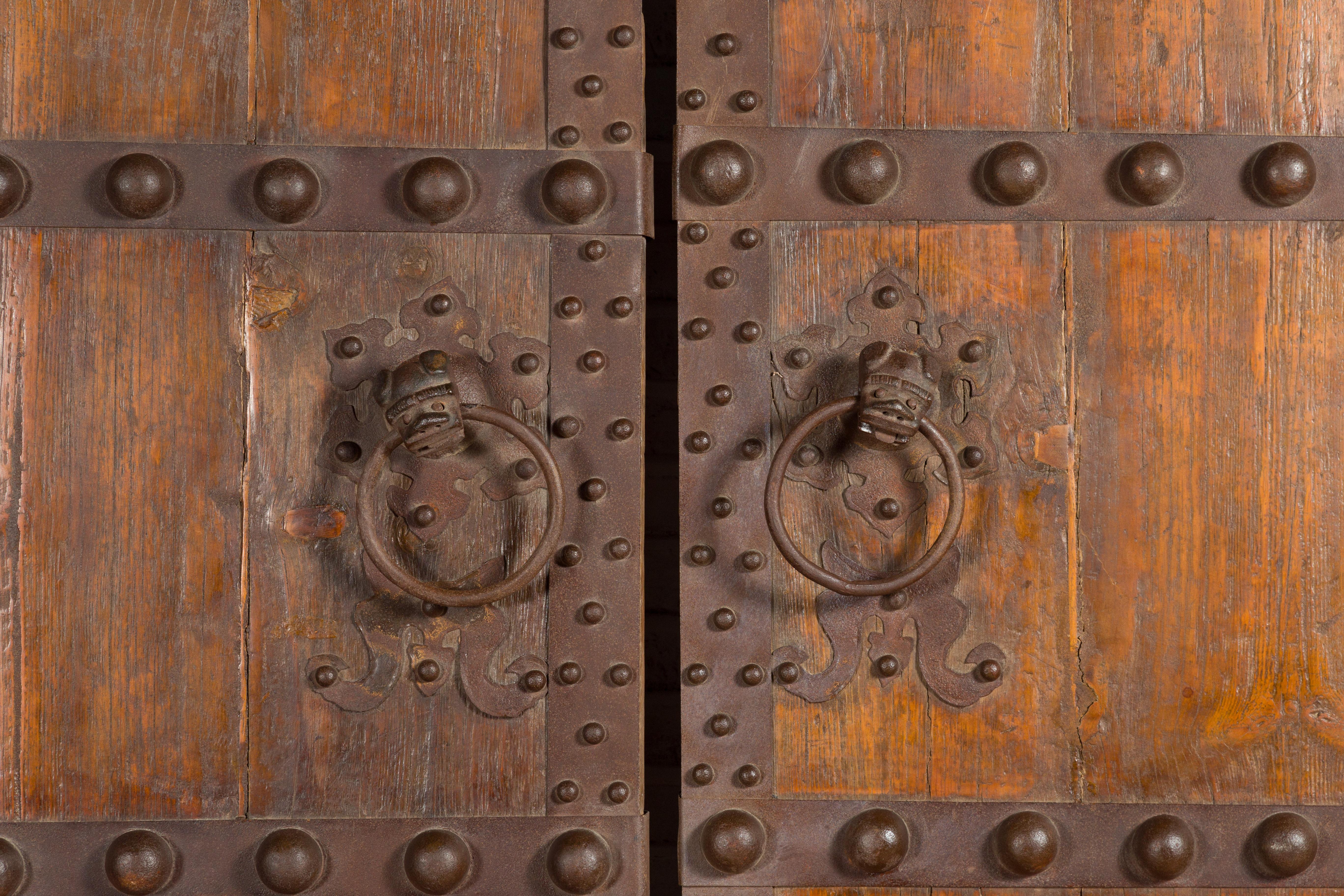 Wood Pair of Chinese Qing Dynasty Palace Doors with Iron Hardware and Dark Patina