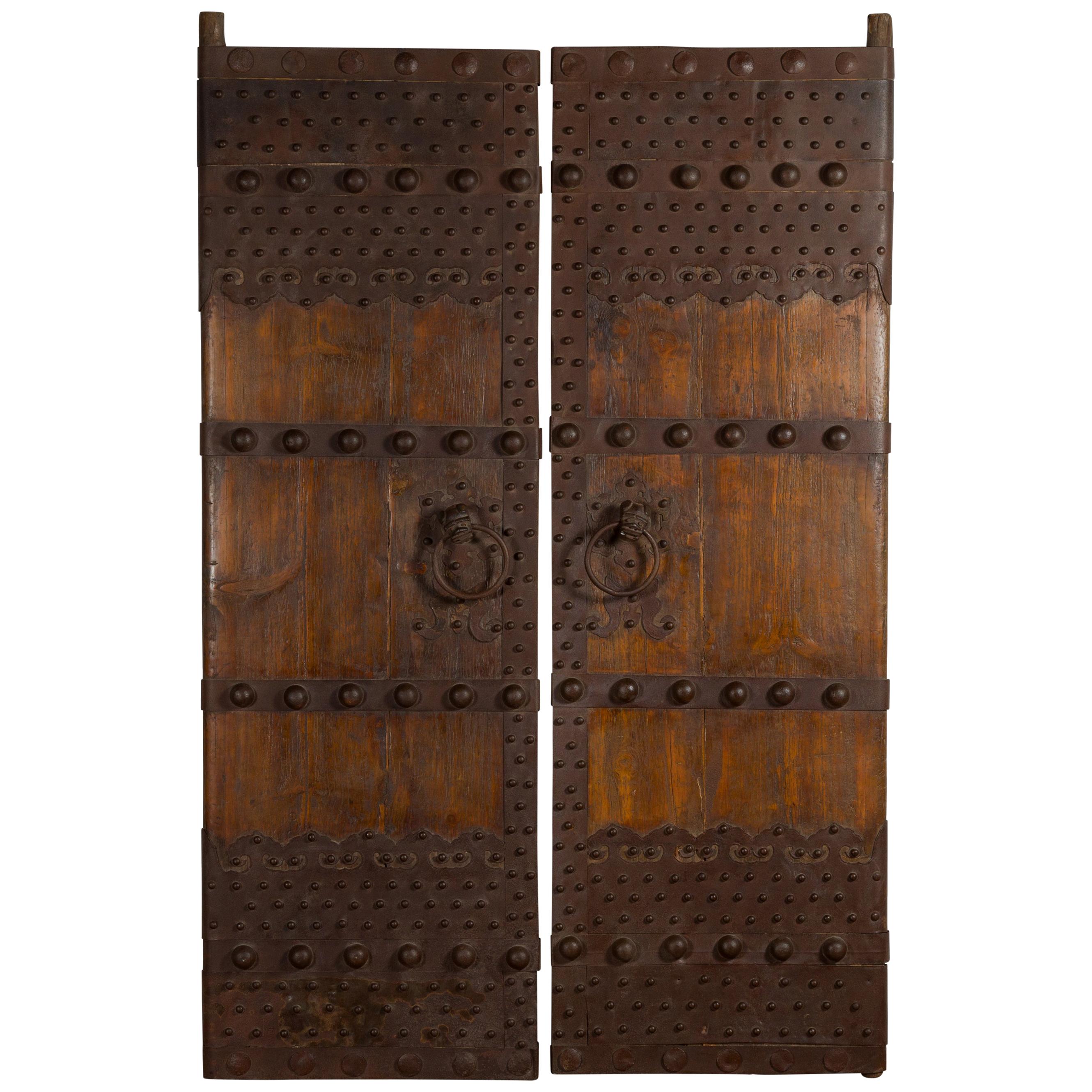 Pair of Chinese Qing Dynasty Palace Doors with Iron Hardware and Dark Patina