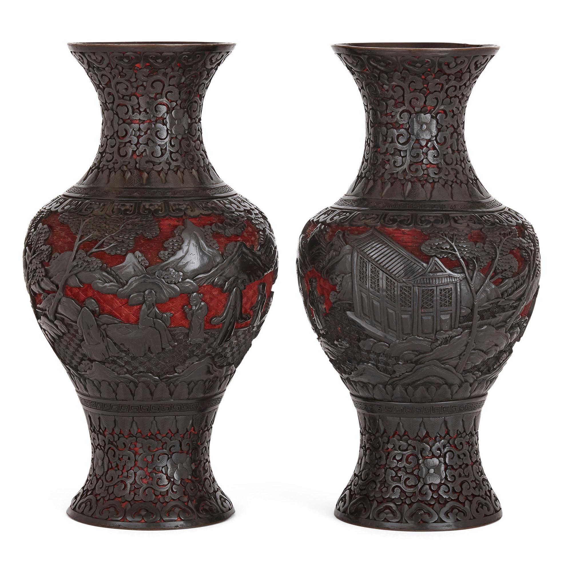 Each vase in this pair is baluster shaped and profusely ornamented with beautifully carved and layered lacquering. The body of each vase is lacquered in the traditional manner, typical of pieces produced during the late Qing dynasty, with black