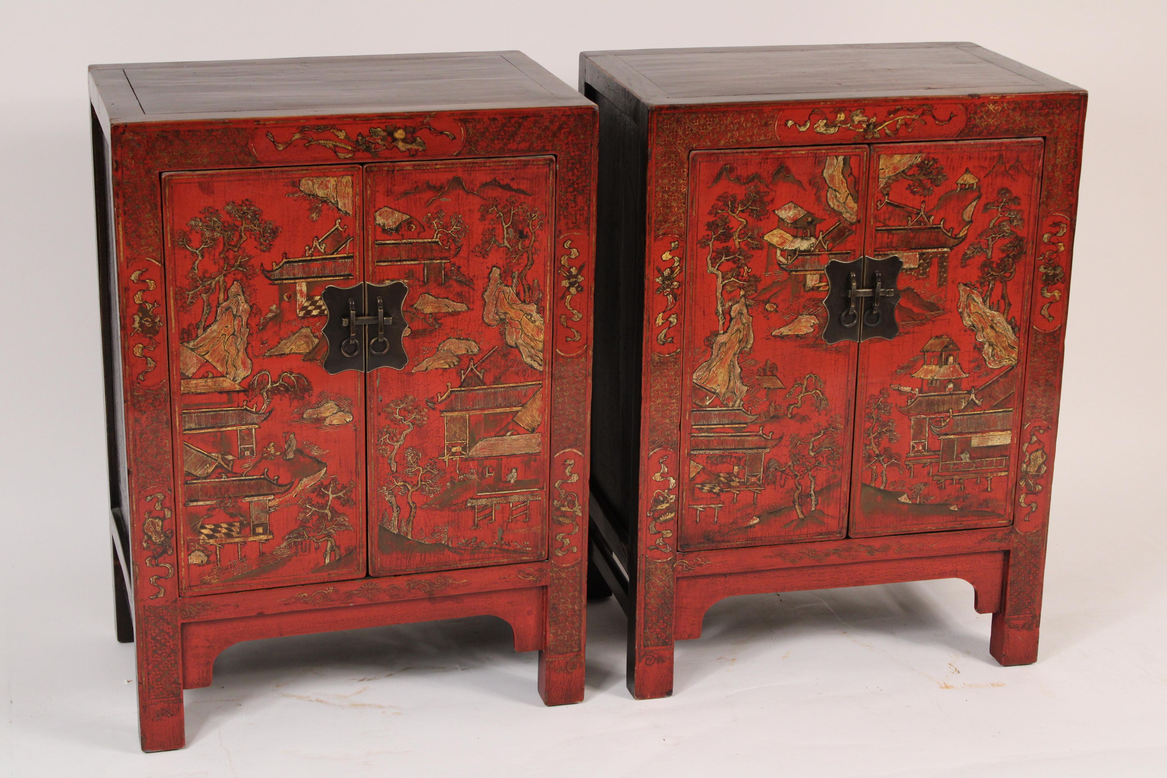 Pair of Chinese red lacquer and gilt decorated two door occasional cabinets, circa mid 20th century. Add a little color to your bedroom with this pair of nightstands or living room with this pair red and gilt decorated Chinese cabinets.