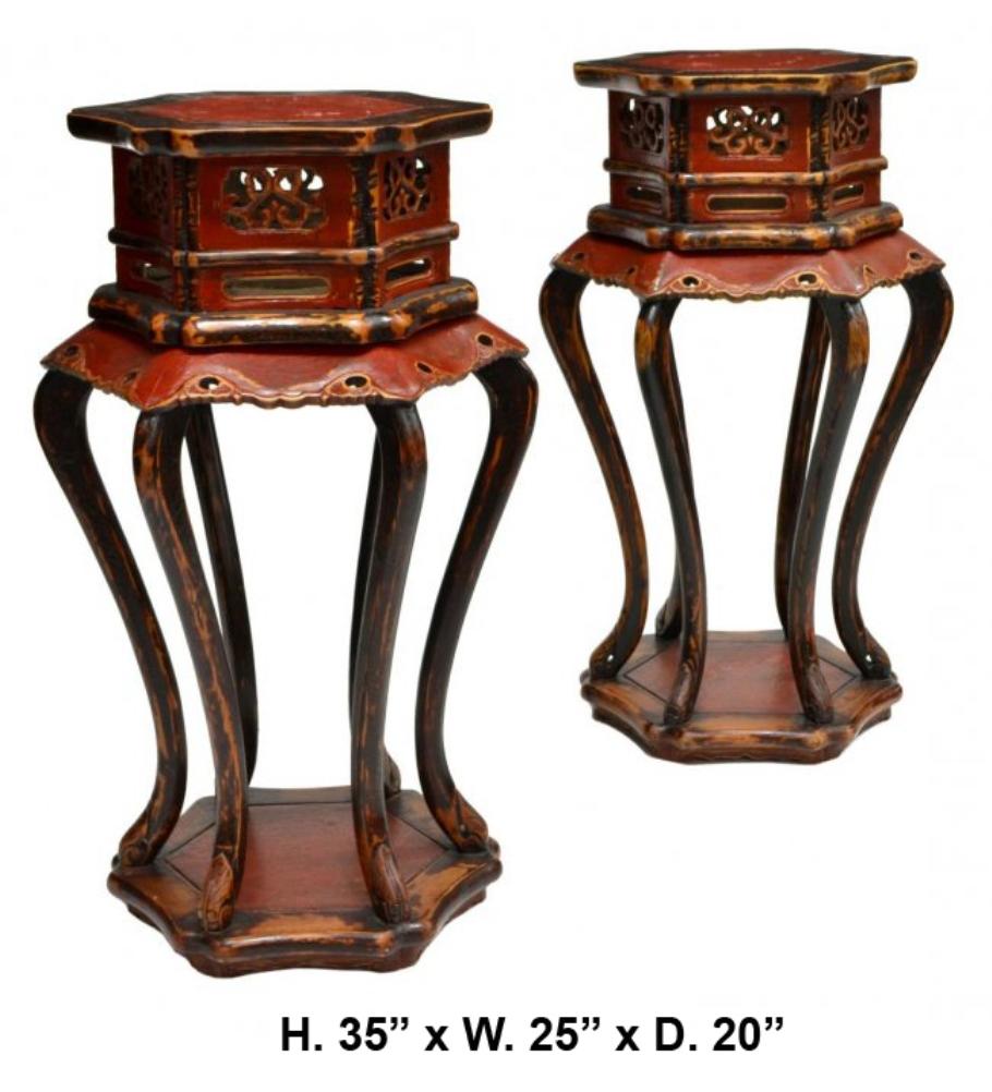 Lovely pair of Chinese red lacquered carved wooden pedestals trimmed with black lacquer. Mid 20th century

Each pedestal is surmounted with a hexagonal top, over a conforming pierced and red lacquered frieze, supported by six whimsical cabriole