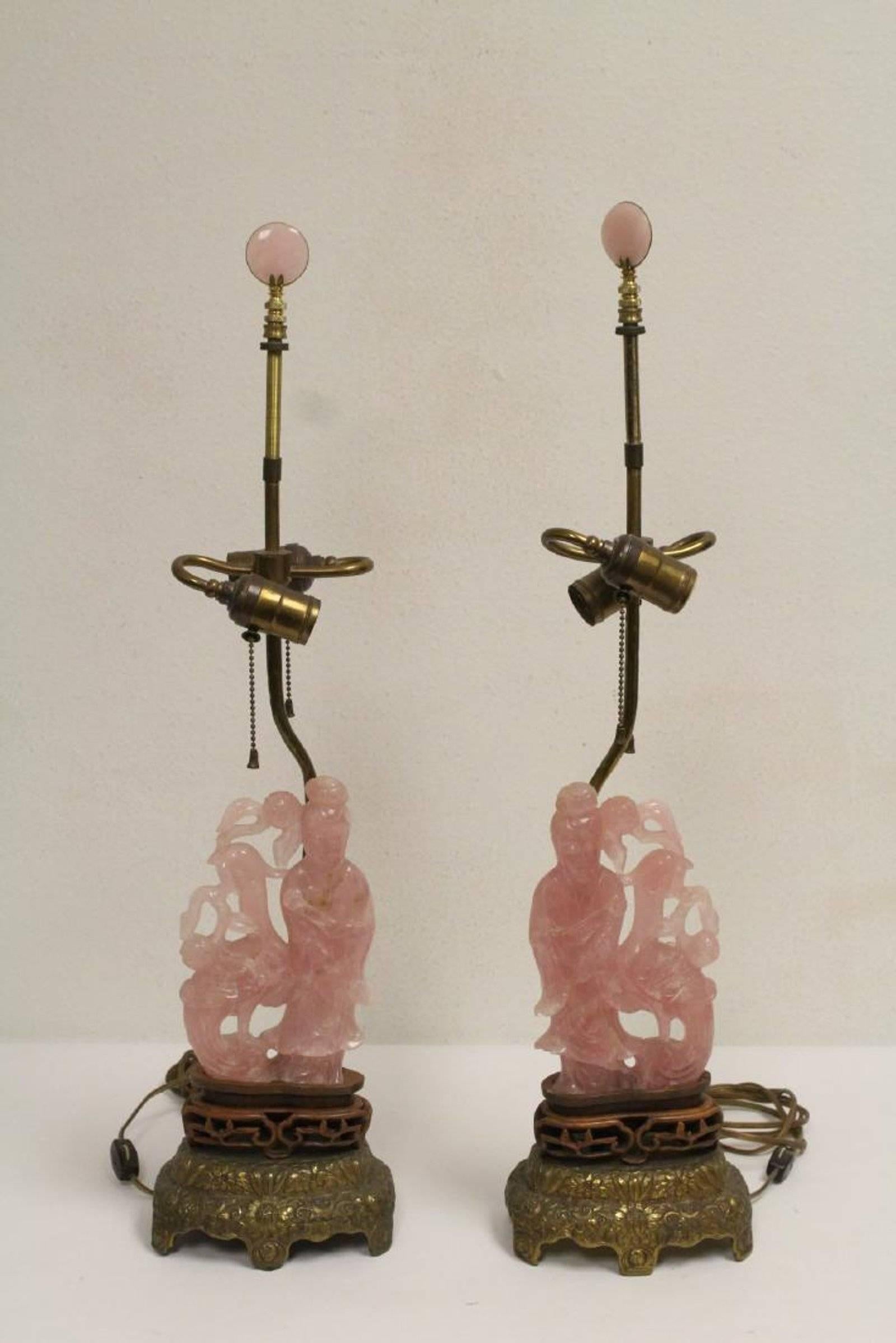 Attractive antique pair of Chinese hand-carved and polished translucent rose quartz carving of a standing Guanyins with phoenix birds mounted to lamps with custom shades and rose quartz finials.

The rose quartz Guanyins dimensions is H. 8 in x W.