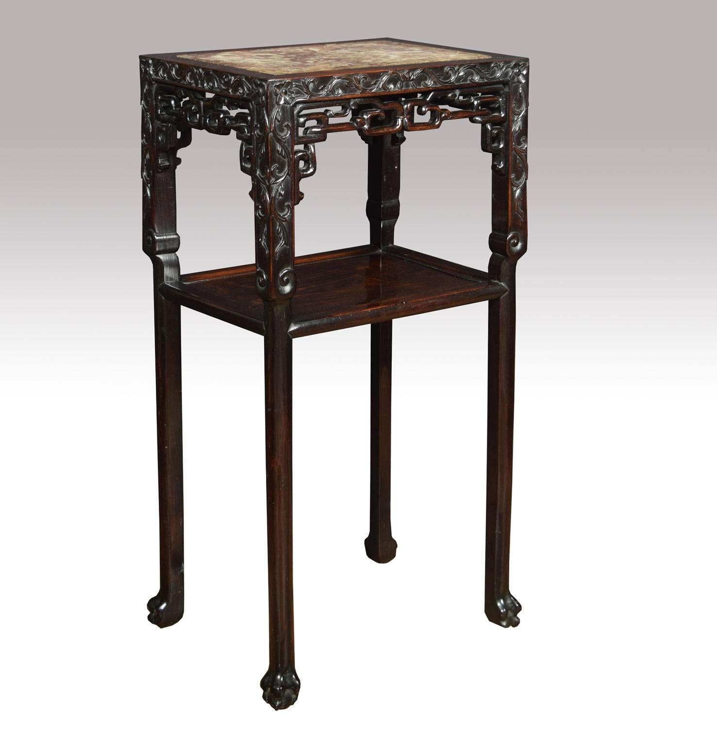 Pair of Chinese rosewood and marble tables, the rectangular top set with panels of variegated marble, above pierced and carved panels and open shelves, on square tapering legs with carved feet.

Dimensions:

Height 31.5 inches.

Width 16.5
