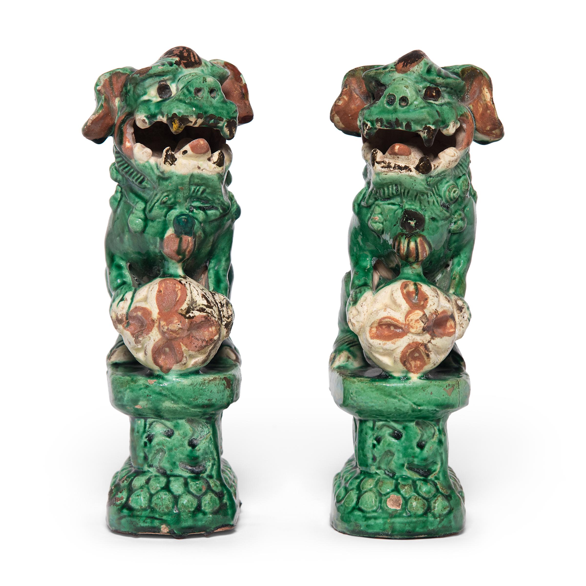 Although these fu dogs may look wicked - with their fearsome expressions and piercing gaze - they're actually benevolent guardians of the home. Also known as shizi, pair of fu dog lions are traditionally placed at the thresholds of sacred spaces,