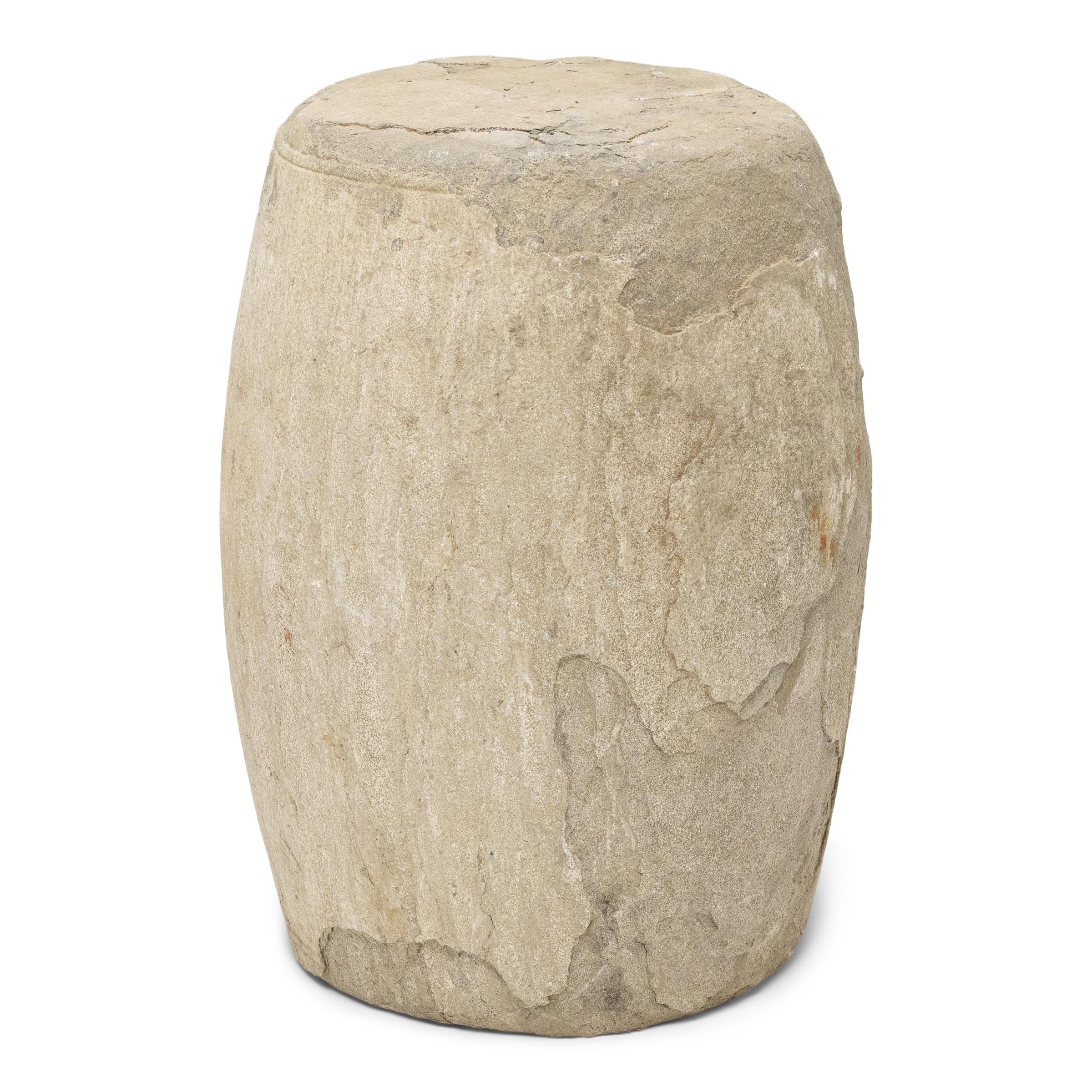 These low drum stools from Shanxi province were hand-carved from solid limestone nearly 300 years ago, designed to add the essential stone element to a traditional Chinese garden. Stone drums such as this were fixtures of courtly gardens and outdoor
