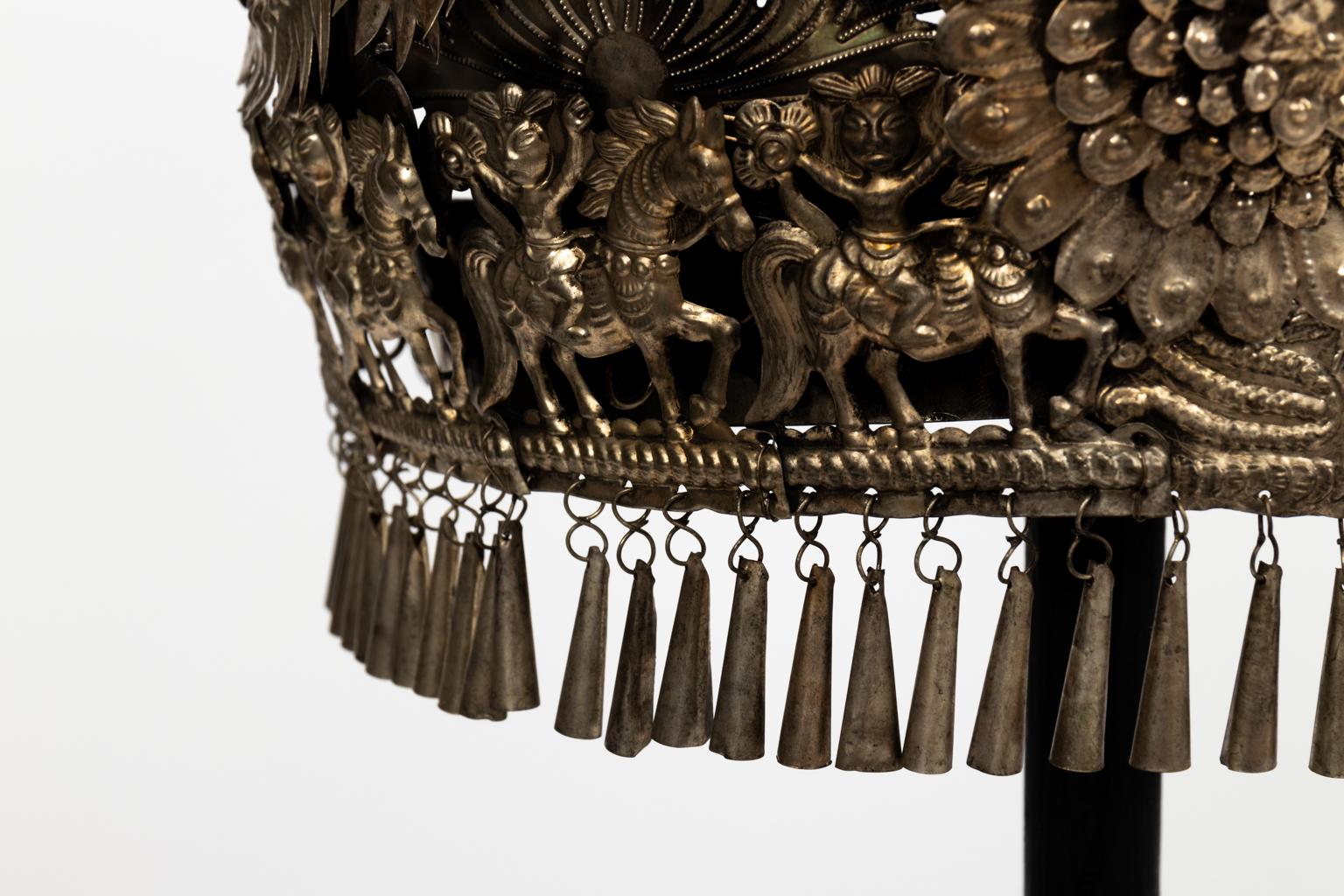 Chinese silver ceremonial wedding headdresses for bride and groom on stands from a later date, circa 19th century. The pieces are heavily decorated with motifs of flowers and horses. Please note of wear consistent with age including finish loss to