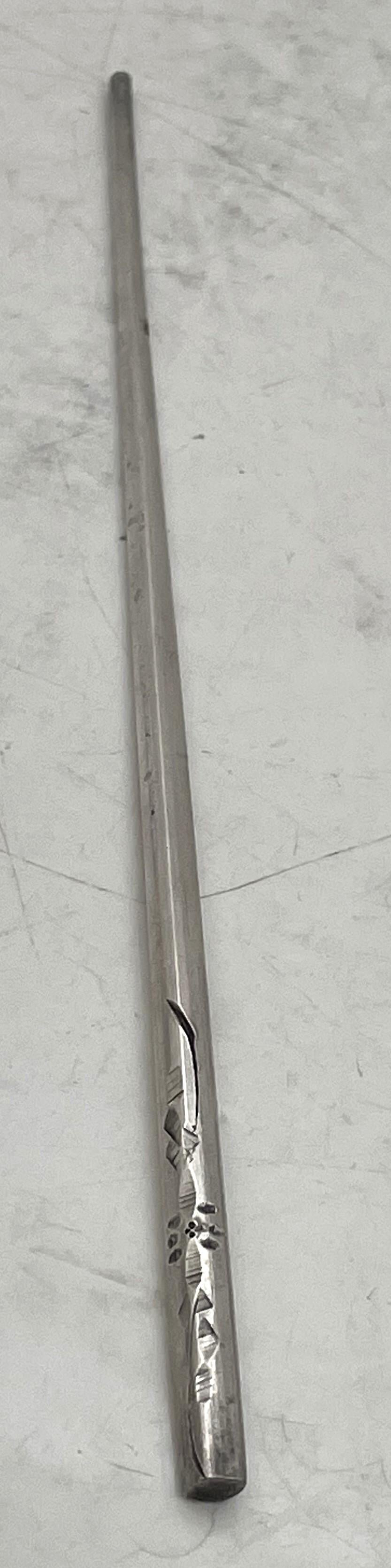 Pair of Chinese silver chopsticks, beautifully adorned with engraved motifs. They measure 7 7/8'' in length by 1/8'' in diameter. Total weight is 1.3 troy ounces (40.3 grams). 

Please feel free to ask us any questions, and please see our other