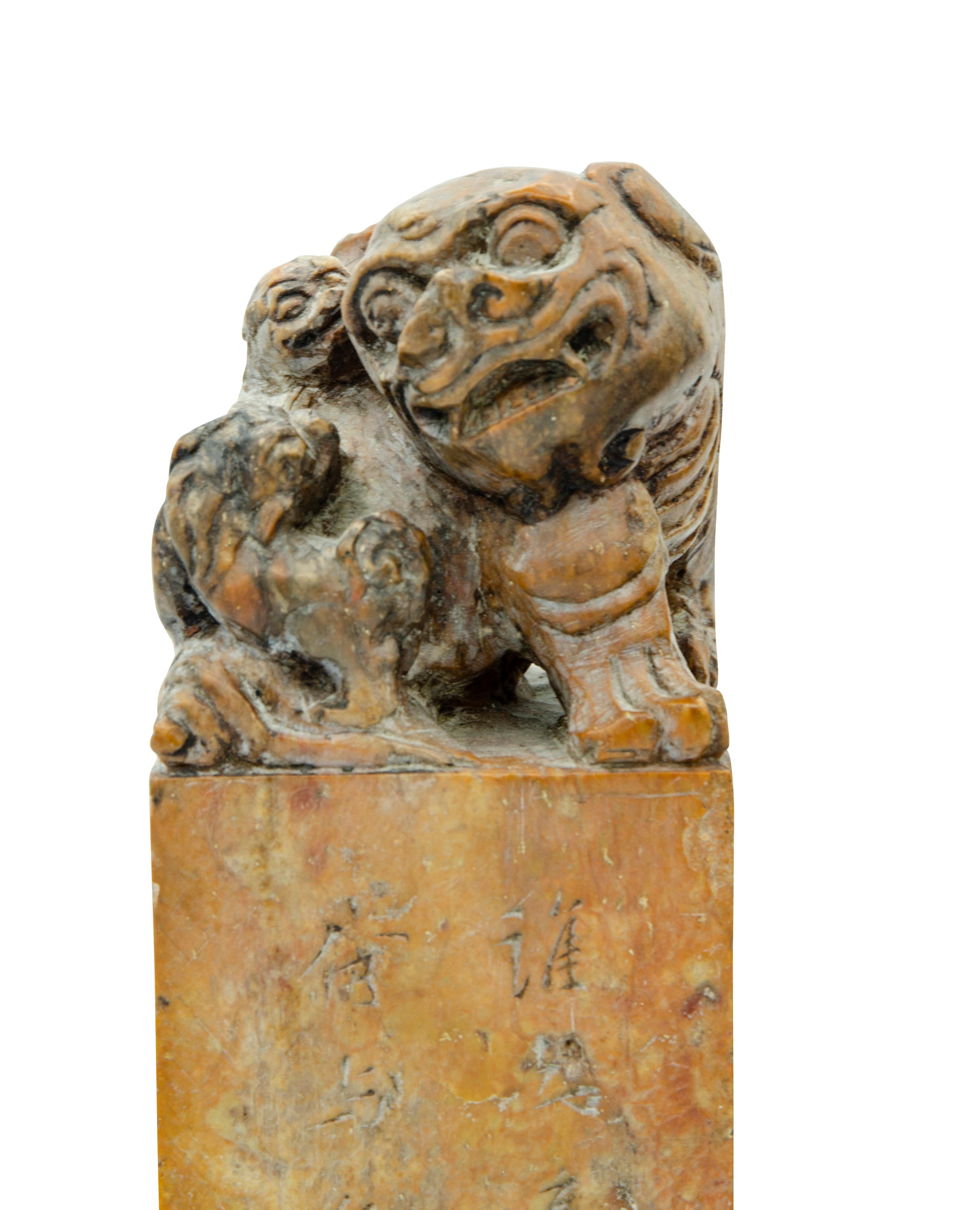 With foo dog carved finials.