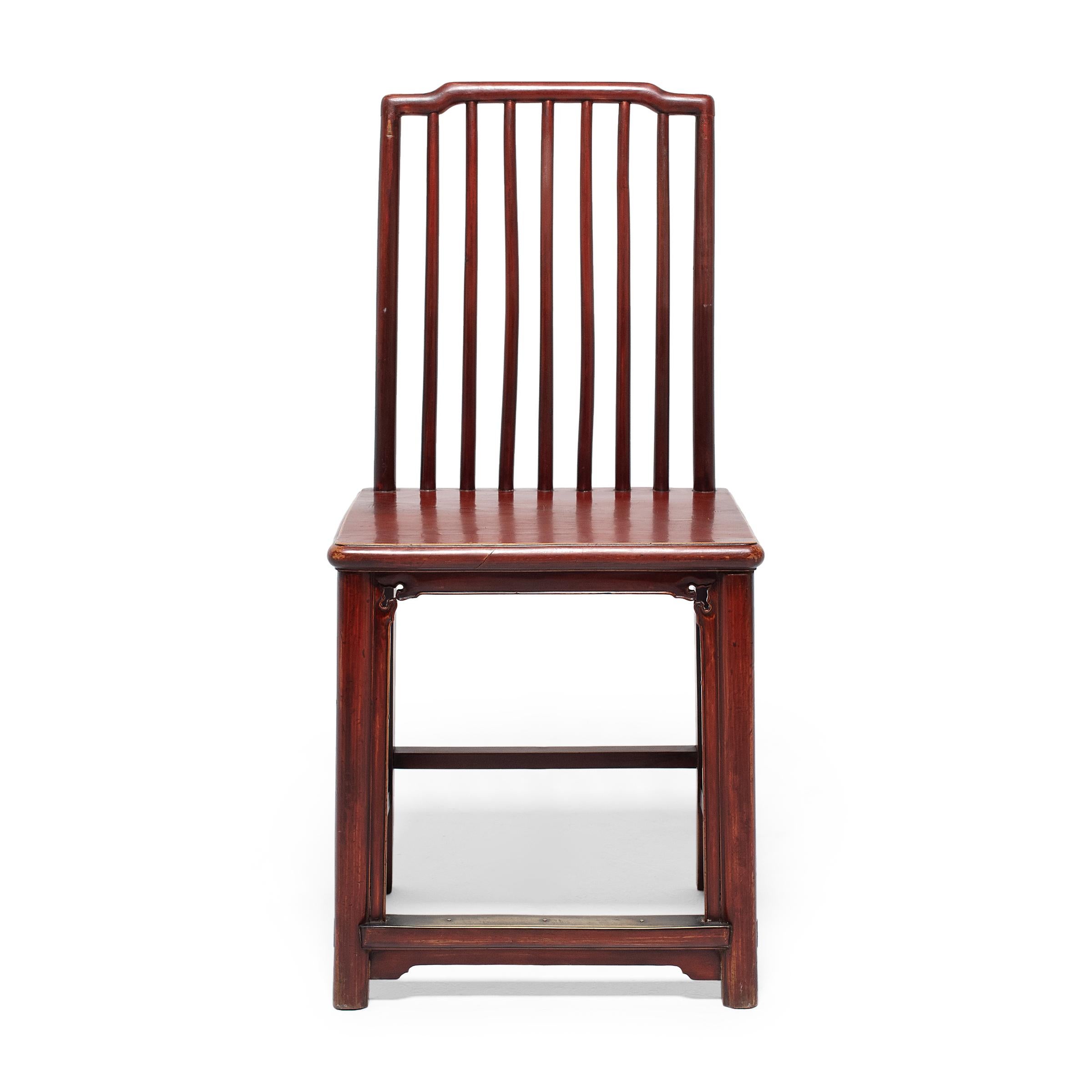 These 19th-century elmwood chairs owe their graceful design to the refined styles and carpentry techniques that emerged during the Ming dynasty, the golden age of Chinese furniture design. The chairs feature square seats, corner legs linked by