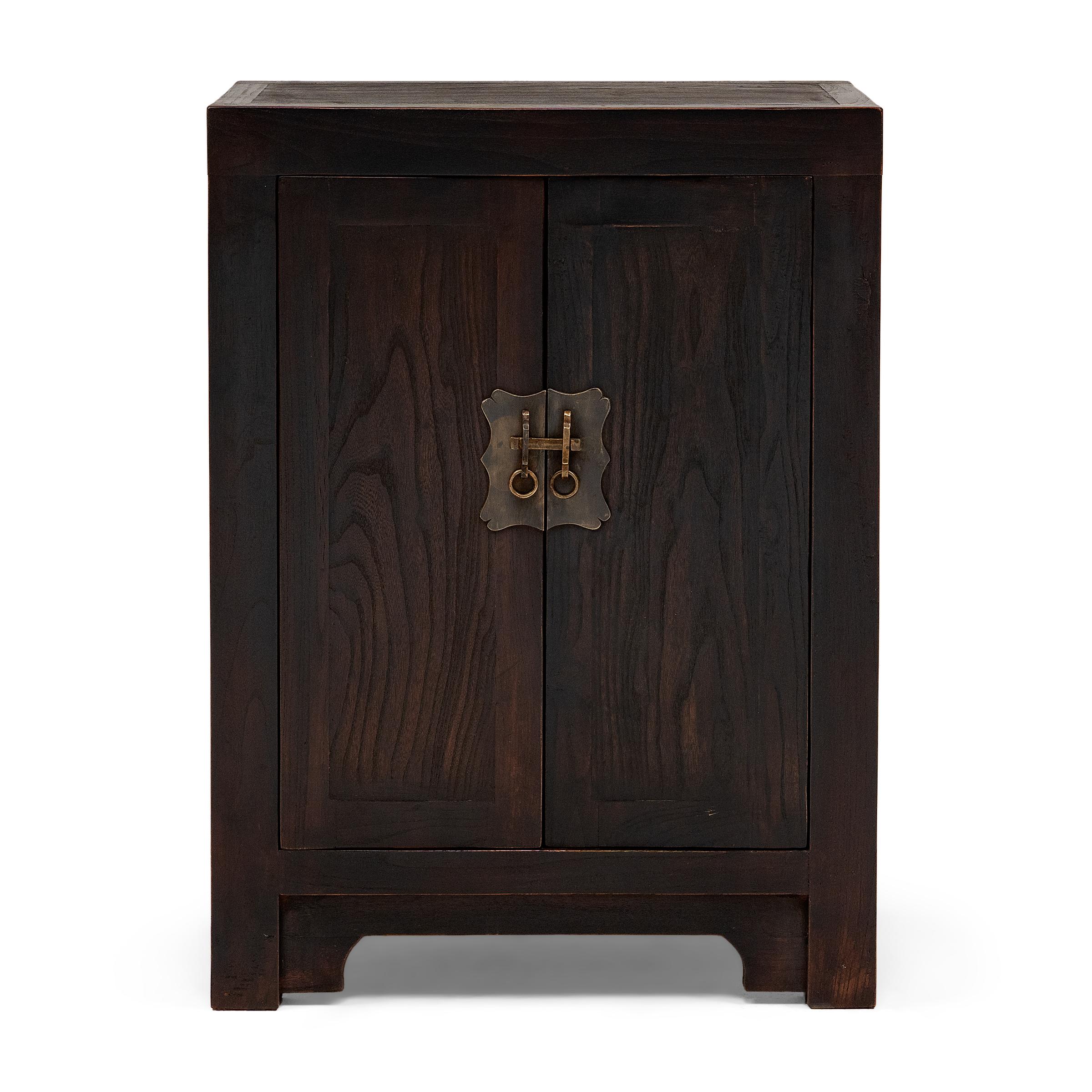 Perfecting line and proportion, the simple design of this pair of low locking chests celebrate the restraint of classic Chinese furniture forms. Crafted from reclaimed elmwood, the cabinets are modeled after those used for general storage in a