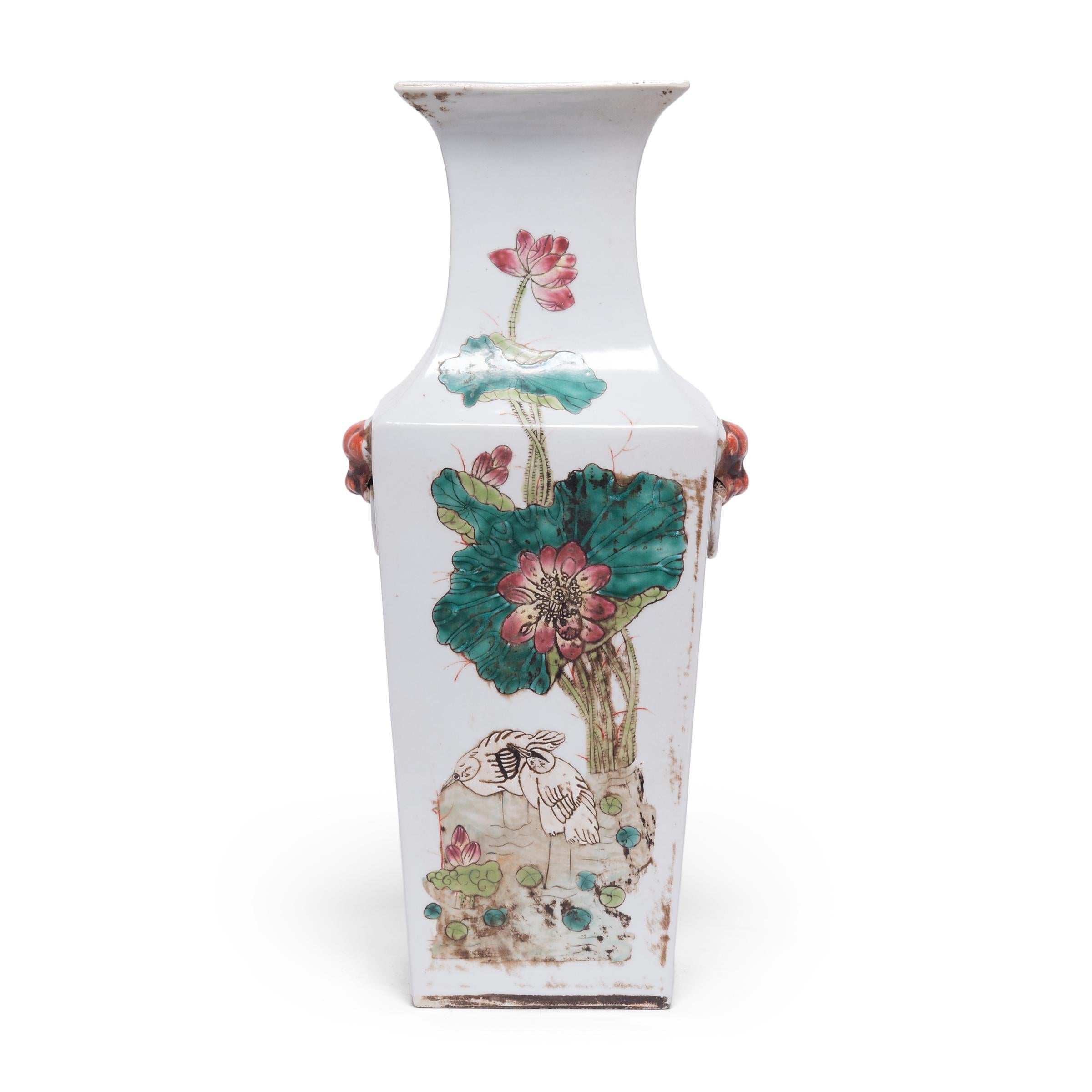 Defined by angular shoulders and a flared lip, this pair of tall porcelain vases offer a charming variation of the classic Chinese phoenix-tail vase form. Each vase is patterned with beautifully scripted poetry and enameled scenes of two egrets