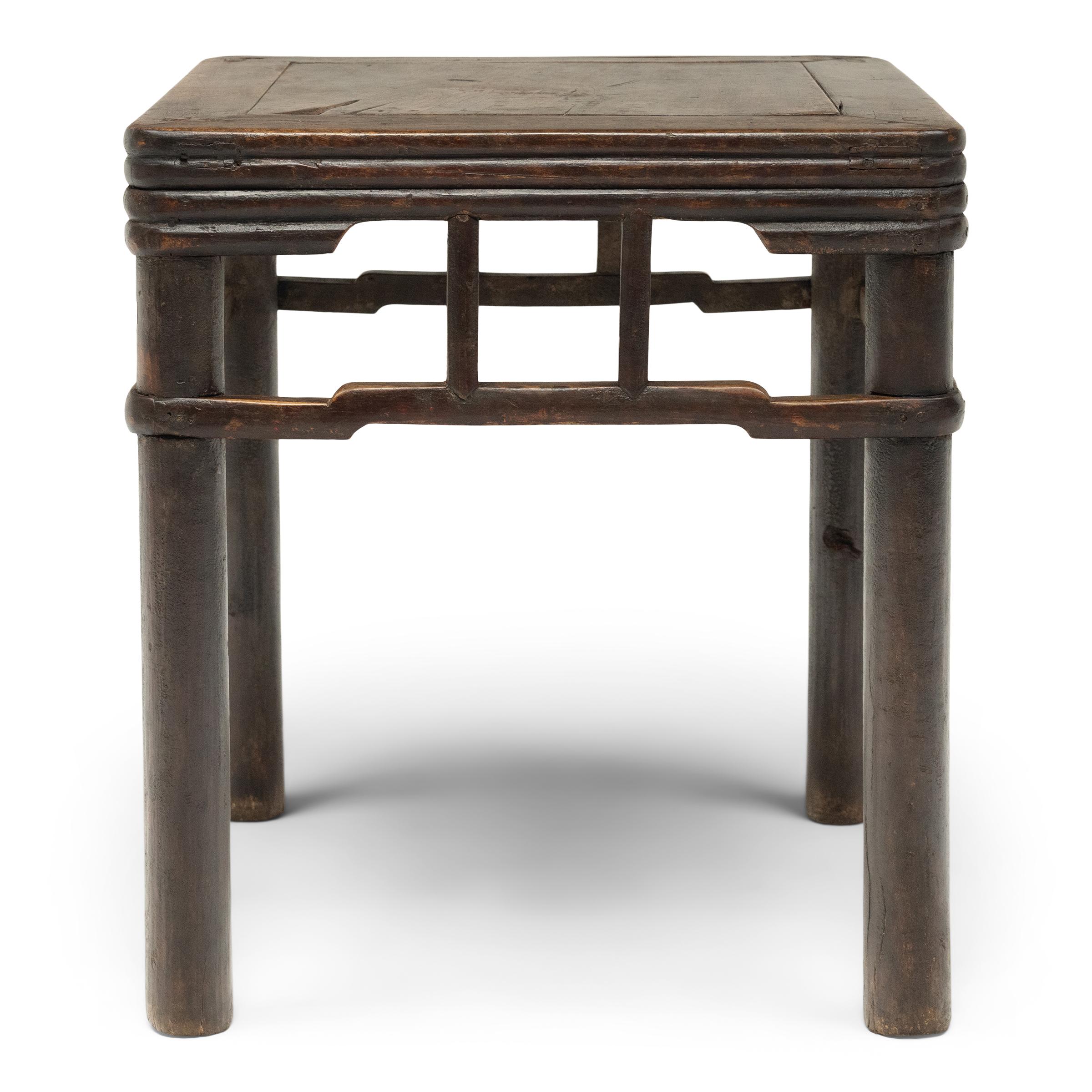 Qing Pair of Chinese Stacked Stretcher Walnut Stools, c. 1850 For Sale