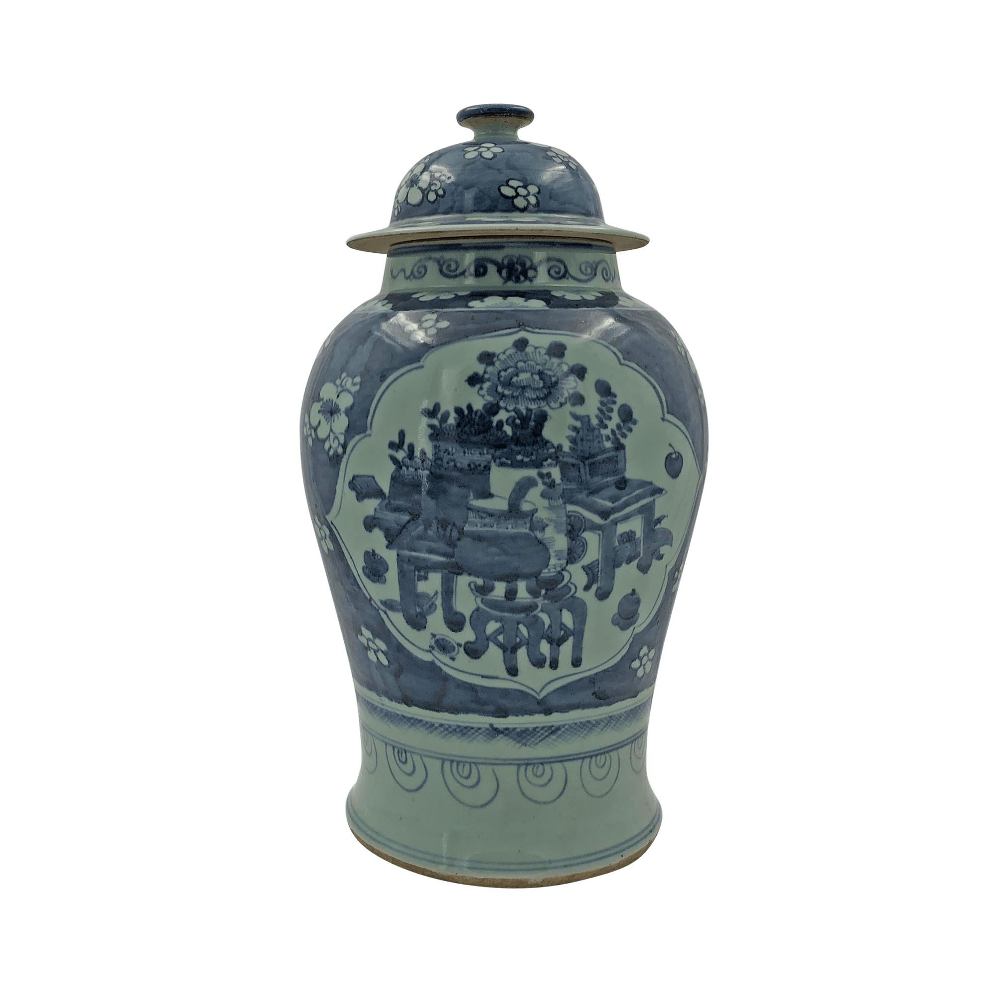 Large pair of Chinese export blue and white lidded Temple jars decorated with panelled still life scenes of furniture and floral arrangements.

  