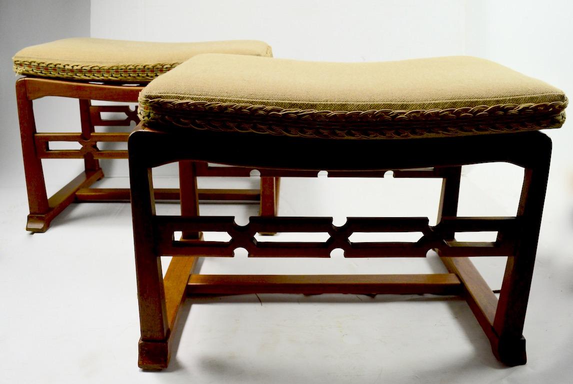 Stylish Chinese style, Asia modern footrests, or ottomans. Solid mahogany with upholstered pad tops (upholstery shows wear) . Both are in very good original condition, solid and sturdy, wood finish shows minor cosmetic wear, scuffs etc, normal and