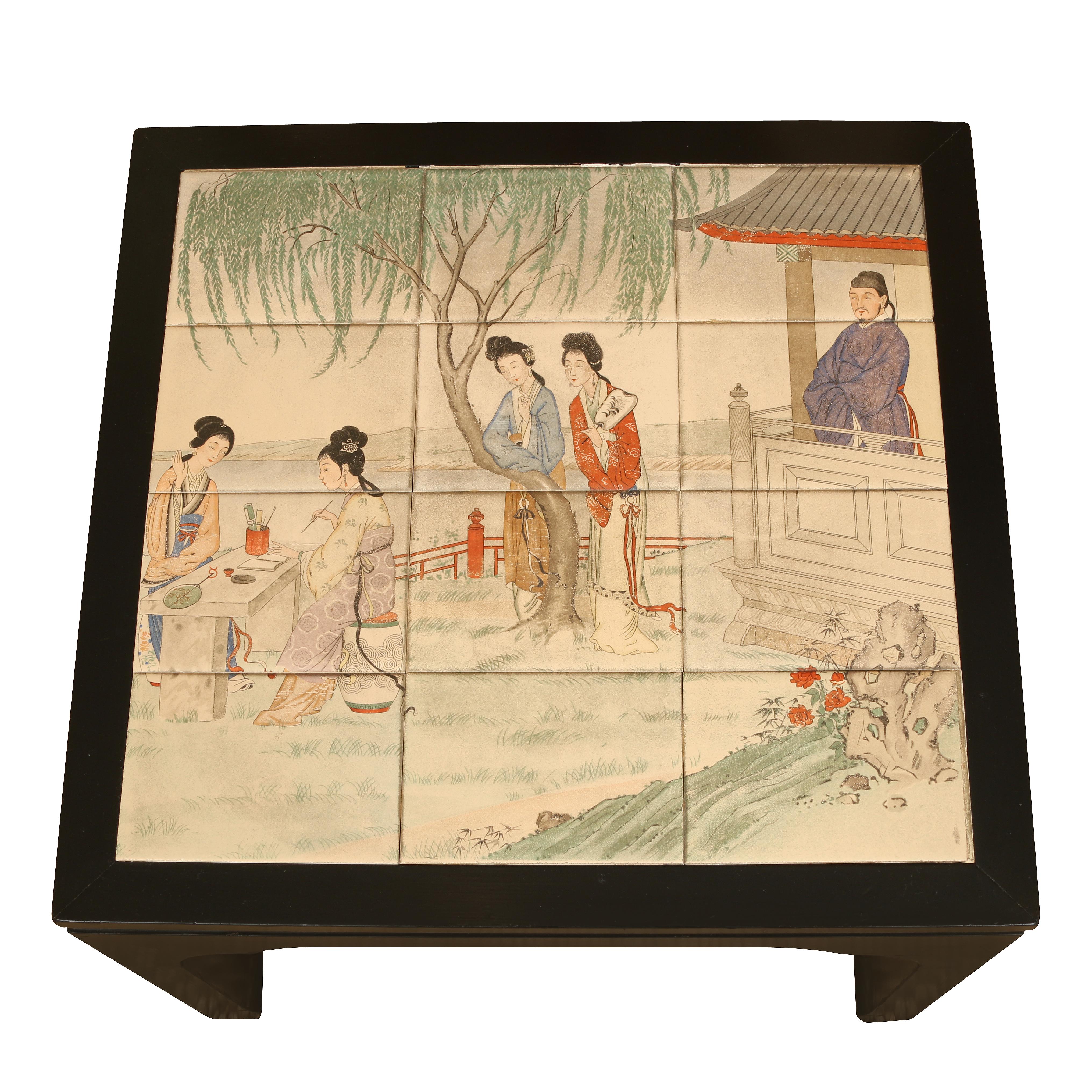 A pair of Chinese style side tables with black lacquer frames and inset ceramic tiles depicting figures in an Asian garden.