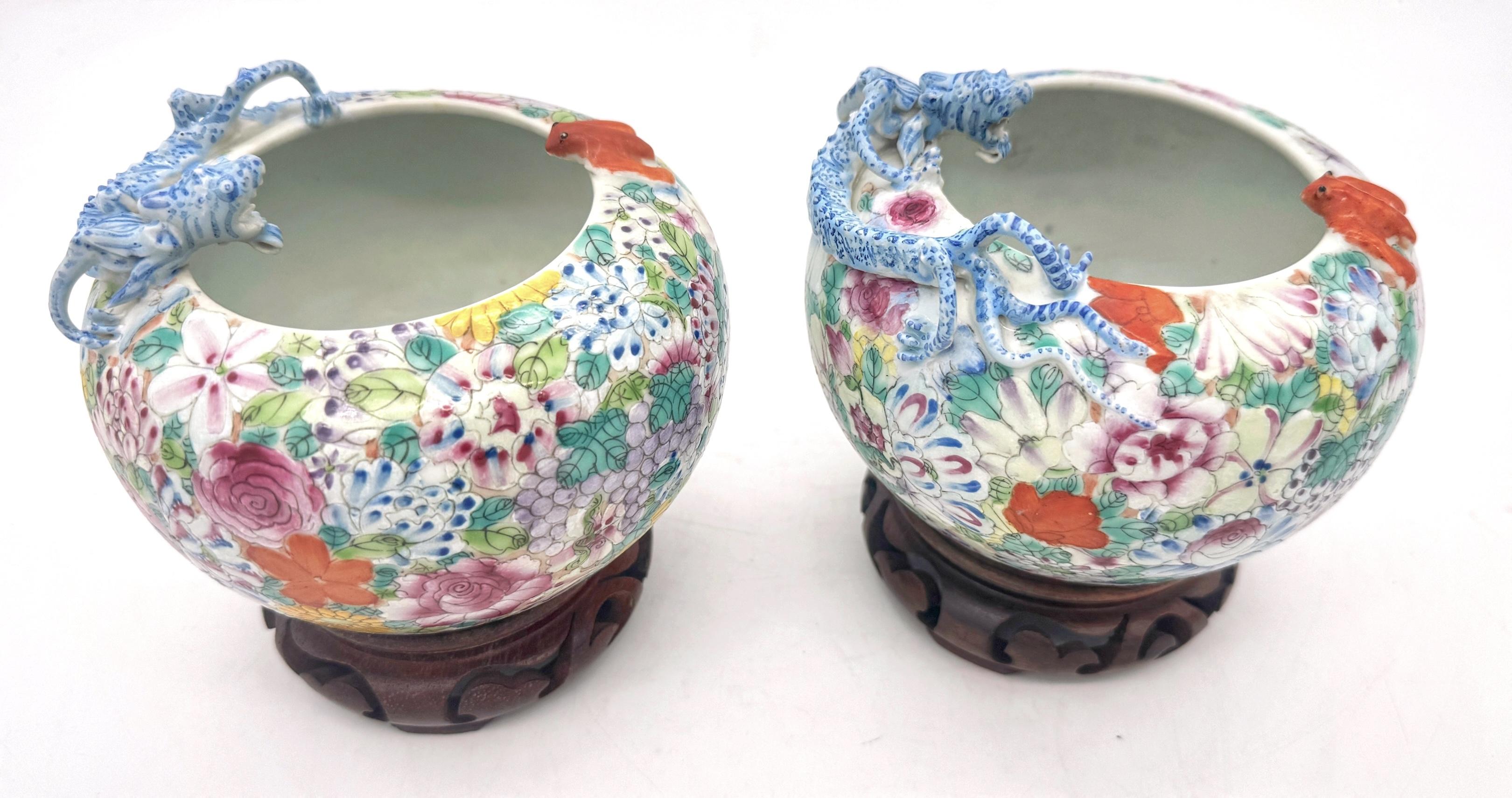 Pair of Chinese Thousand Flowers Porcelain Figural Vases 
Late Qing Dynasty (1644-1911)

A stunning pair of Chinese Thousand Flowers Porcelain Figural Vases from the Late Qing Dynasty (1644–1911). These exquisite vases (sometimes identified as