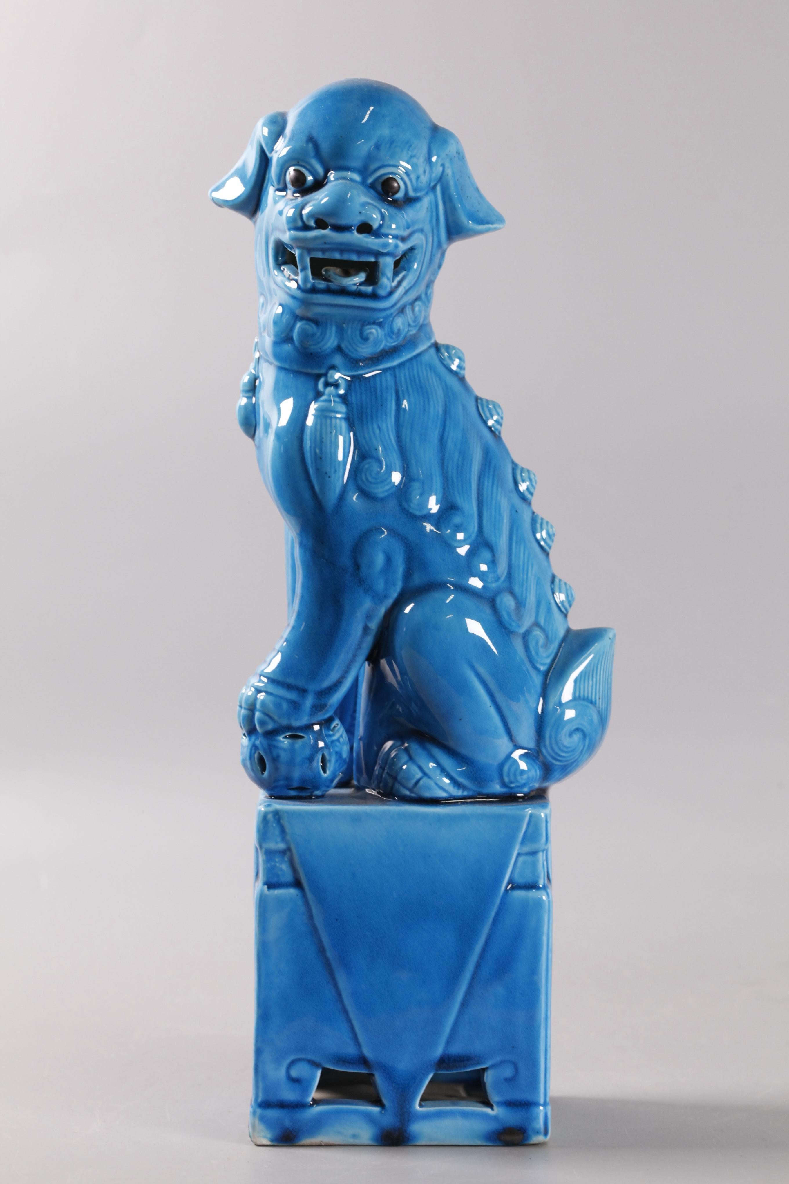 Porcelain pair of Chinese turquoise glazed porcelain foo lions/dogs For Sale