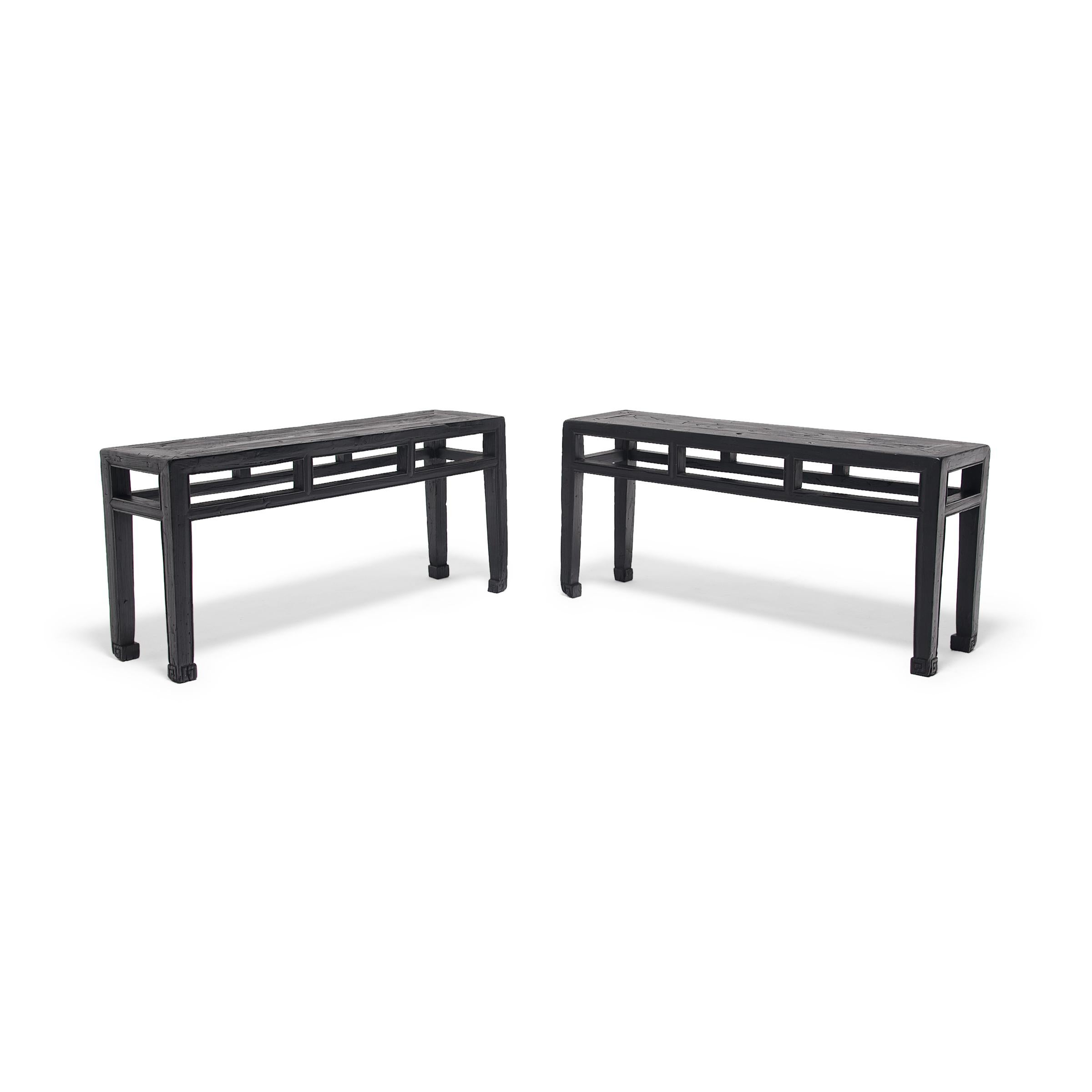 Dated to the early 20th century, these square corner benches from China's Hebei province have clean lines and balanced proportions. Each bench was constructed of mortise-and-tenon joinery with a floating panel top, straight legs, and an open,