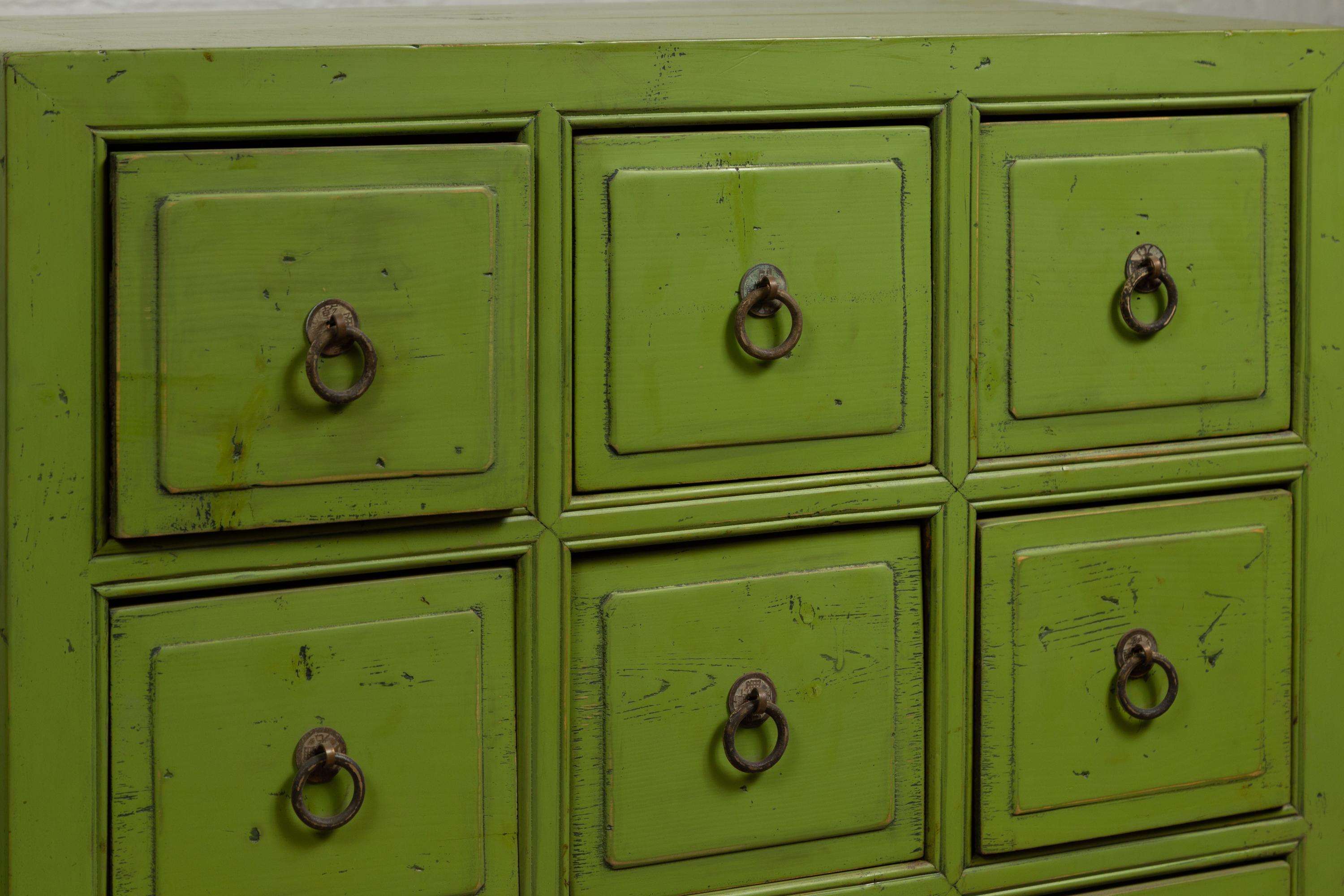 20th Century Pair of Chinese Vintage Green Painted Nine-Drawer Apothecary Bedside Chests