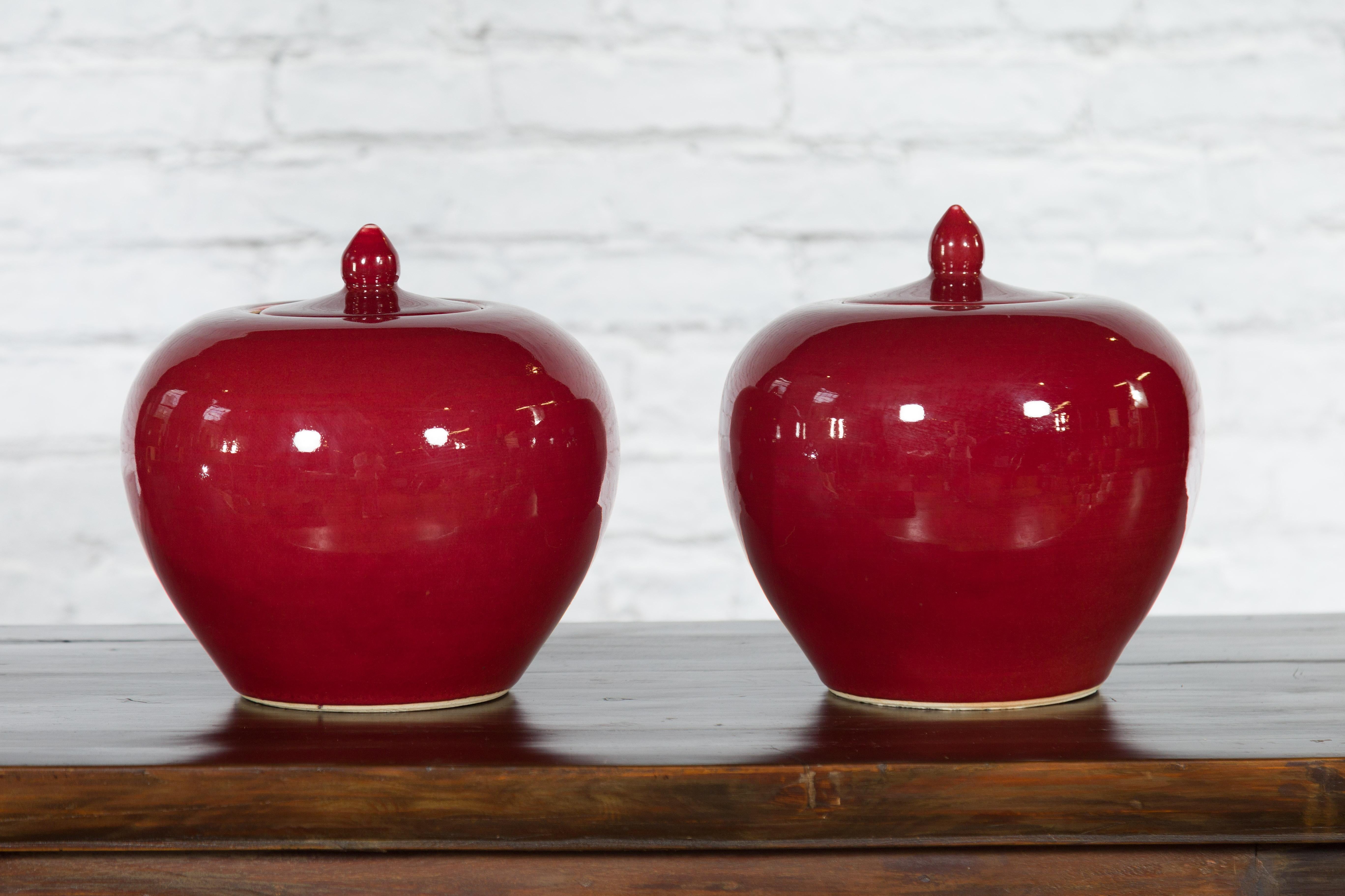 20th Century Pair of Chinese Vintage Jars with Oxblood Finish and Petite Lids For Sale