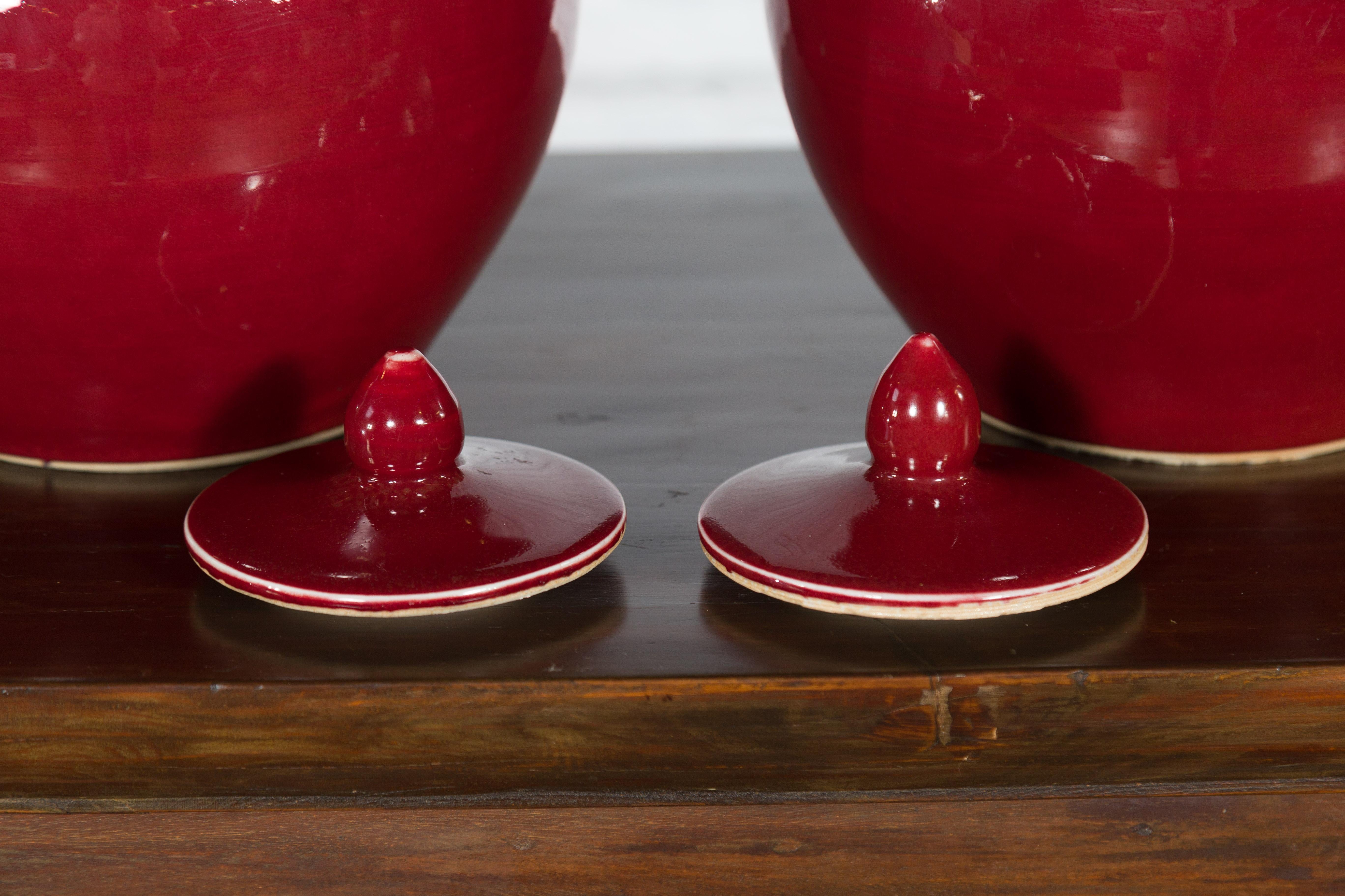 Ceramic Pair of Chinese Vintage Jars with Oxblood Finish and Petite Lids For Sale