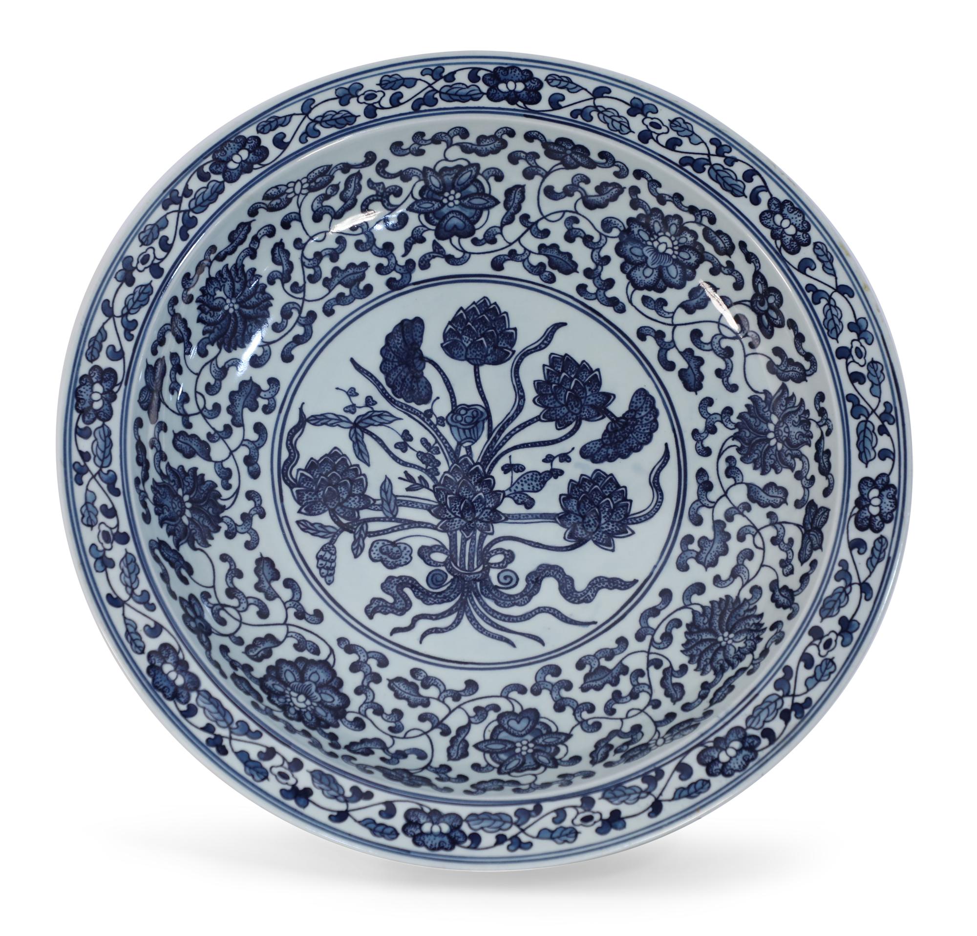 Pair of Chinese blue and white porcelain decorative plate painted with thin blue double lines surrounding a floral garland along the rim, opening to a wider floral and swirling vine motif on the interior that surrounds a central floral bouquet, and