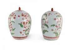 Pair of Chinese White and Pink Cherry Blossom Motif Lidded Porcelain Urns