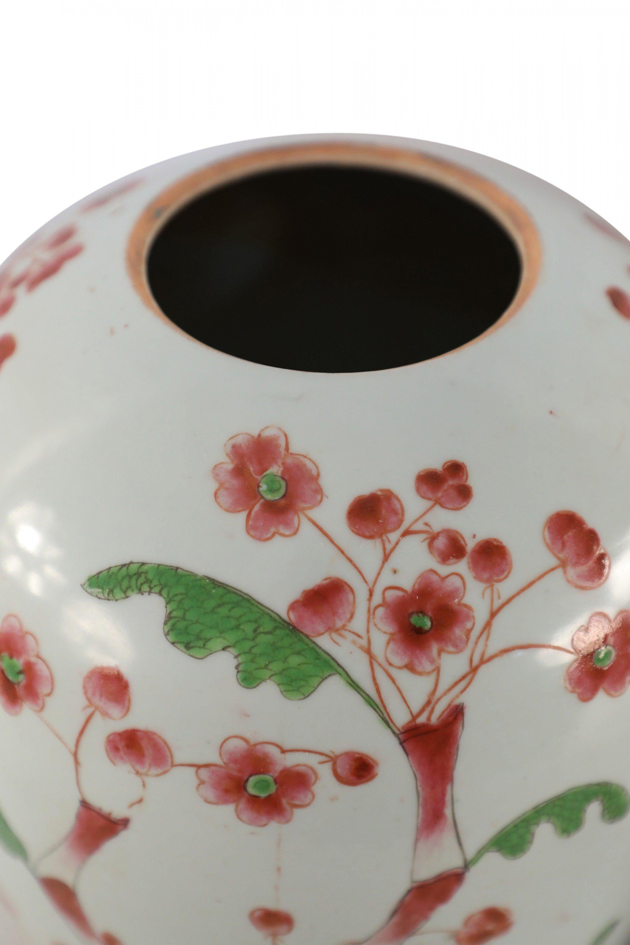 20th Century Pair of Chinese White and Pink Cherry Blossom Motif Lidded Porcelain Urns For Sale
