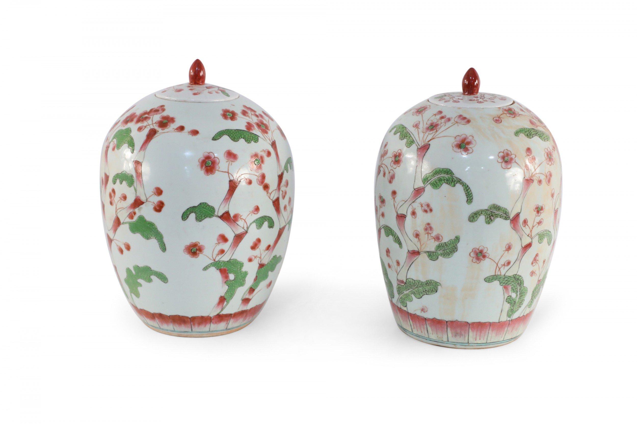 Pair of Chinese White and Pink Cherry Blossom Motif Lidded Porcelain Urns For Sale 4