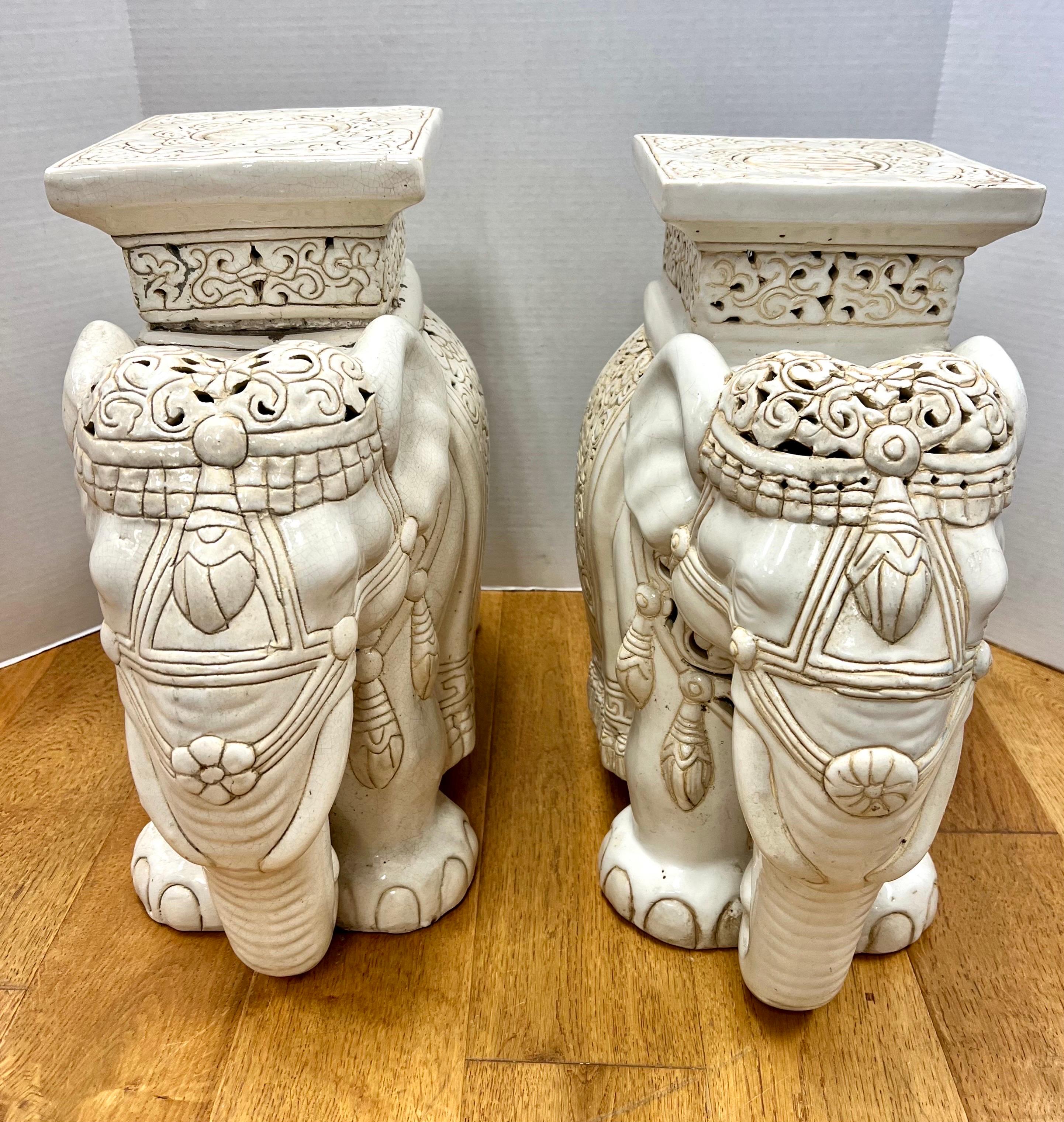 Vintage pair of chinoiserie style white elephant ceramic garden stools with intricate carved detail all around. Use as a garden seat, plant stand or small table.
Whatever you do, own the best!