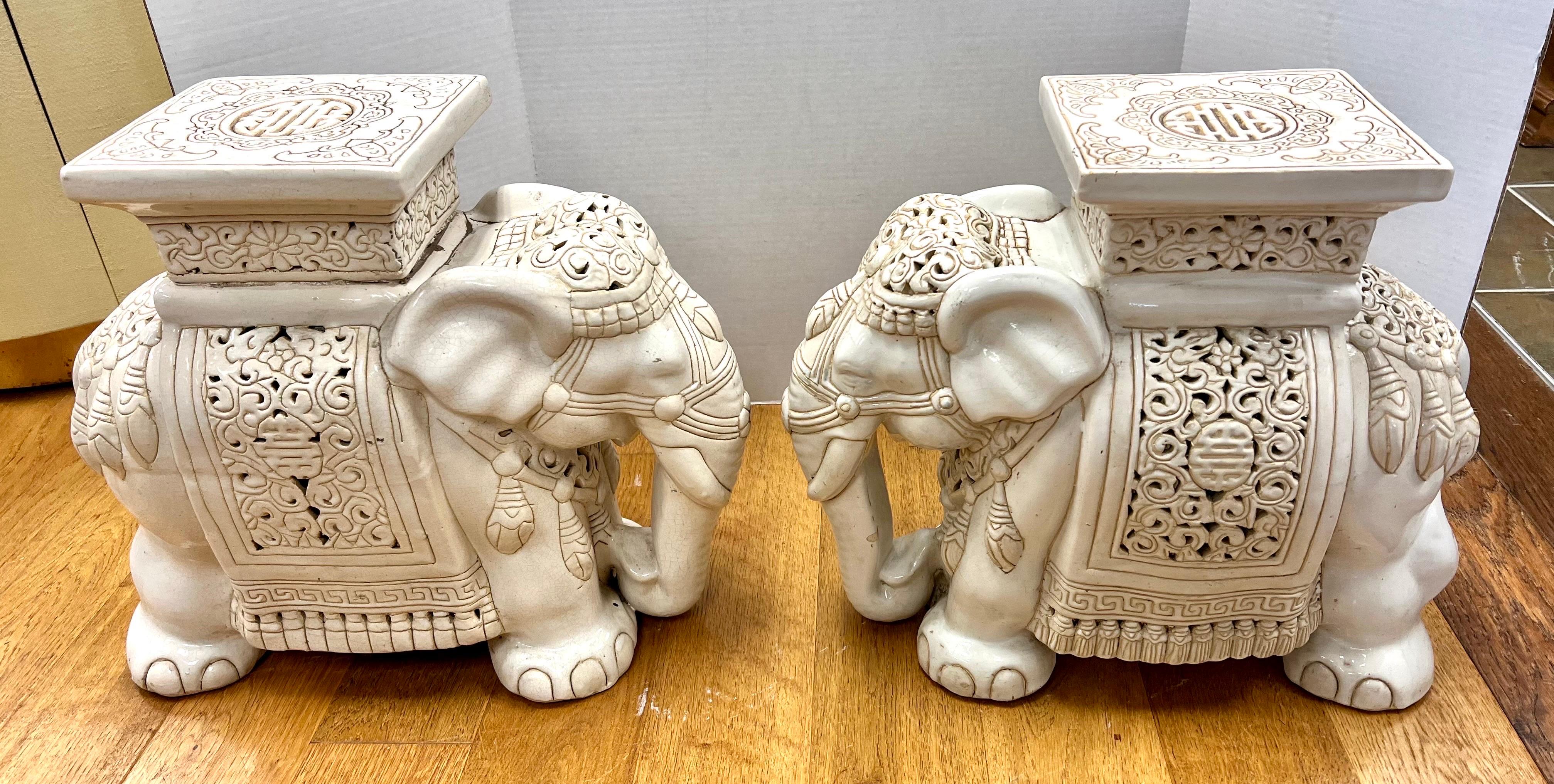 white ceramic elephant plant stand