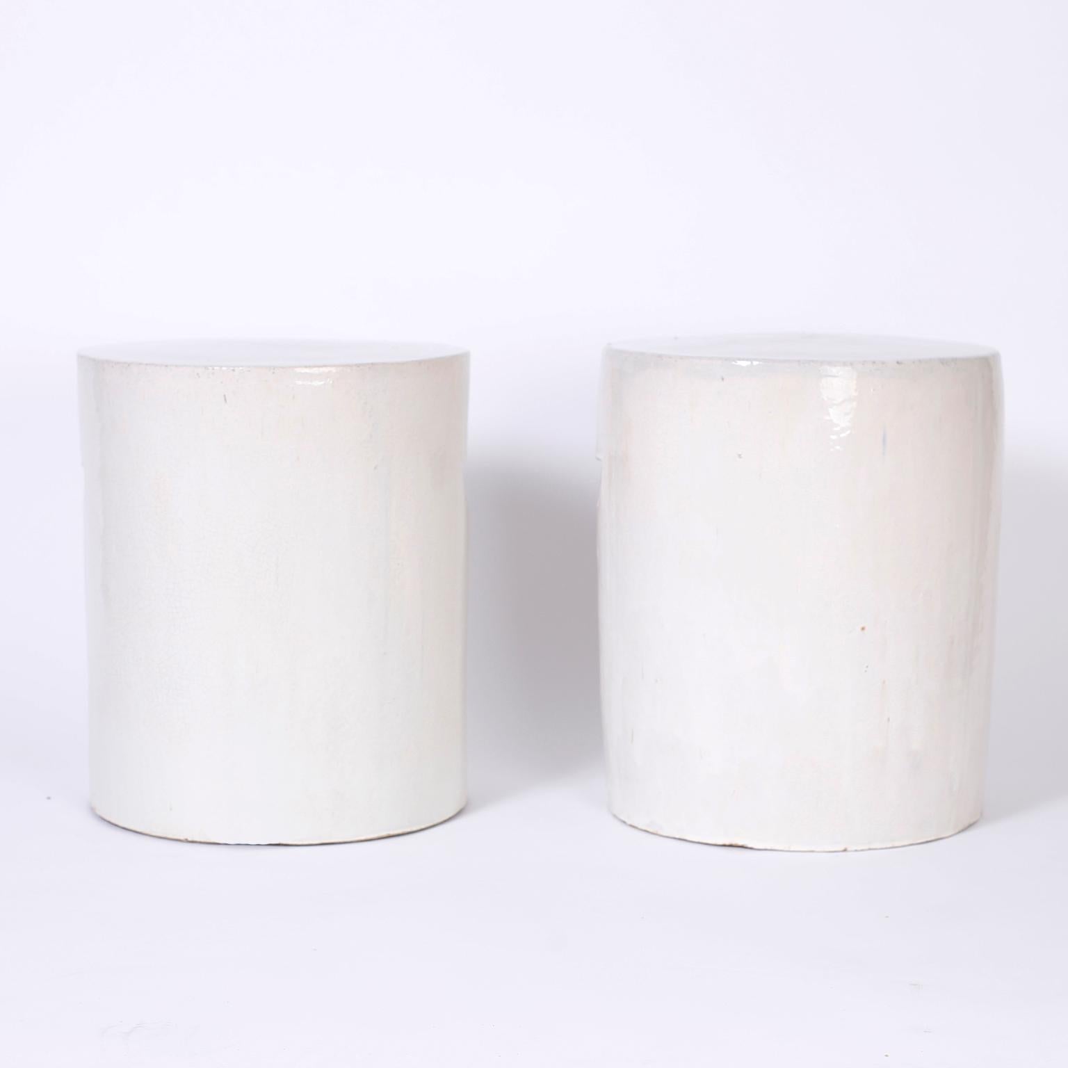 Chic pair of terracotta garden seats with a translucent white or off white celadon crackle glaze over a sleek modern form.