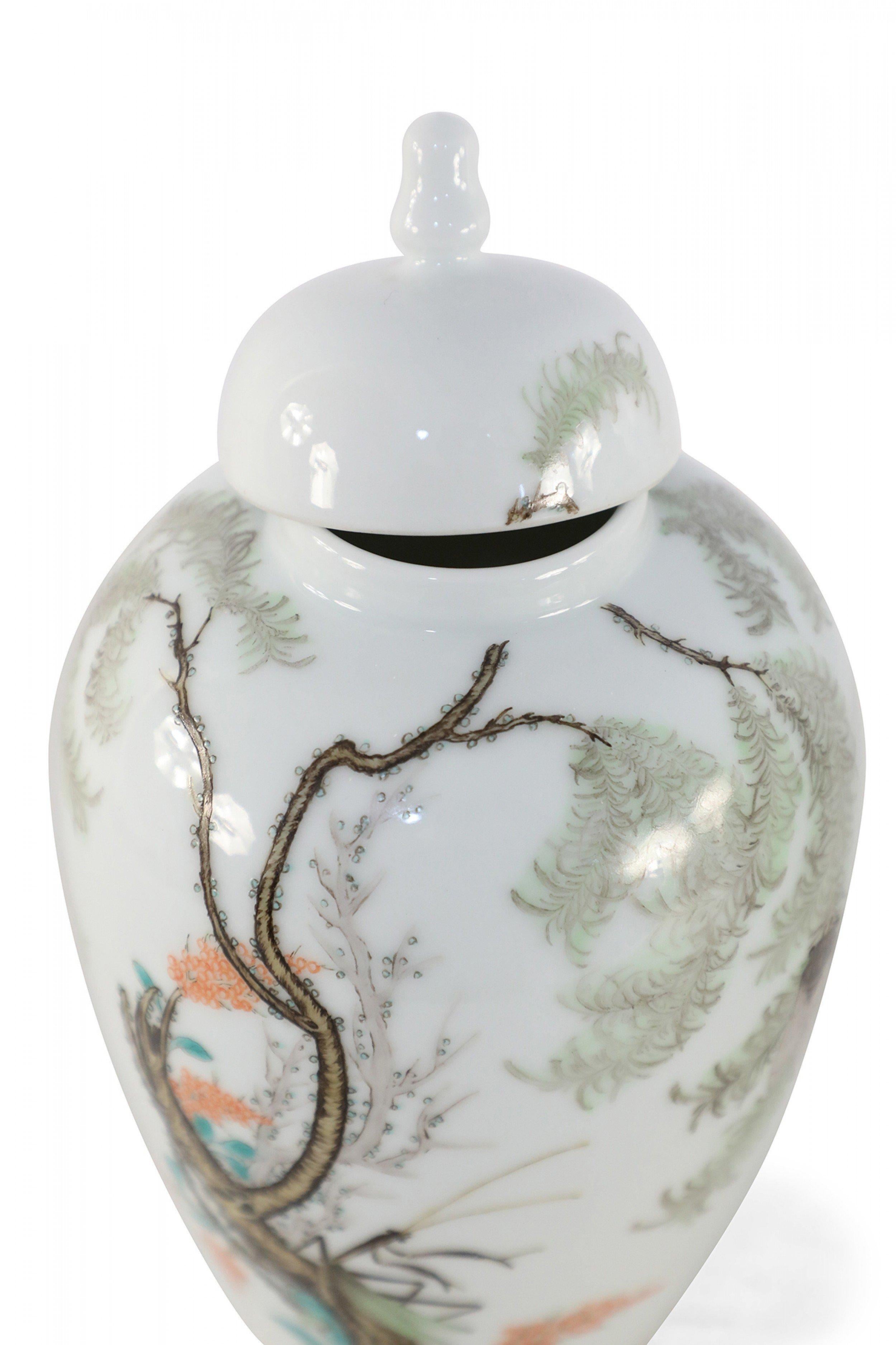 Hand-Painted Pair of Chinese White Porcelain Famille Rose Lidded Jars For Sale
