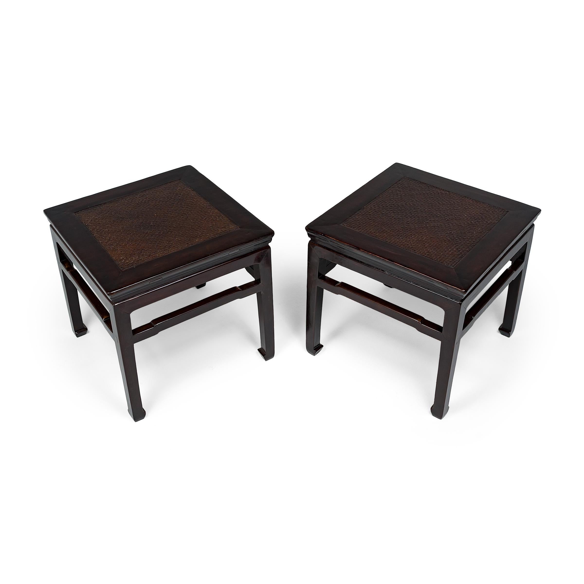 These 19th-century square stools from Shanxi province are elegantly crafted in the classical Chinese style with simple lines and balanced proportions. This form of square stool, or fang deng, was a versatile seating option used throughout a