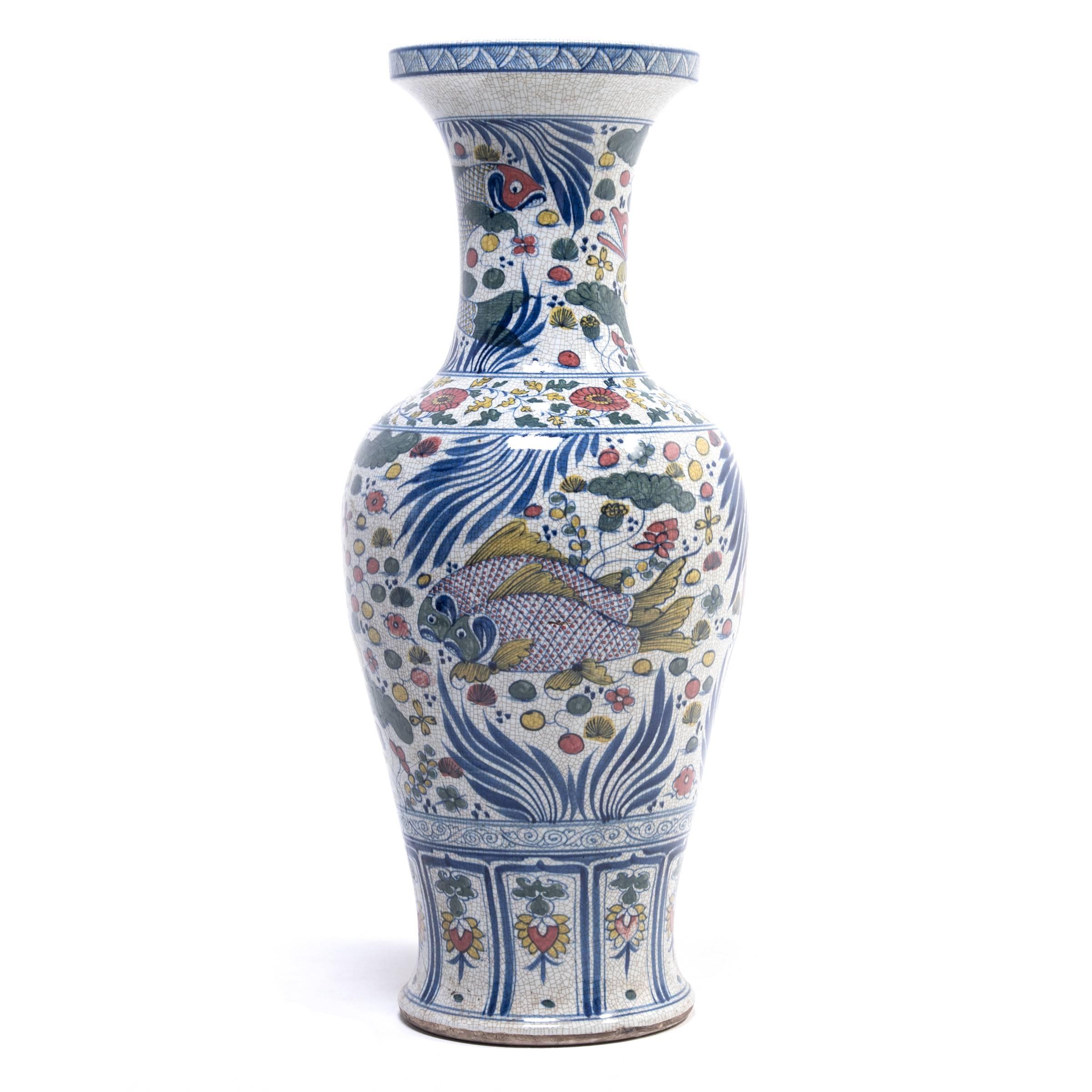 Hand-sculpted by an artisan from China's Jiangxi province, these contemporary standing vases pay colorful tribute to the time-honored style of wucai ware. Translated as “five-color,” wucai was an innovation of the Ming dynasty that employed several