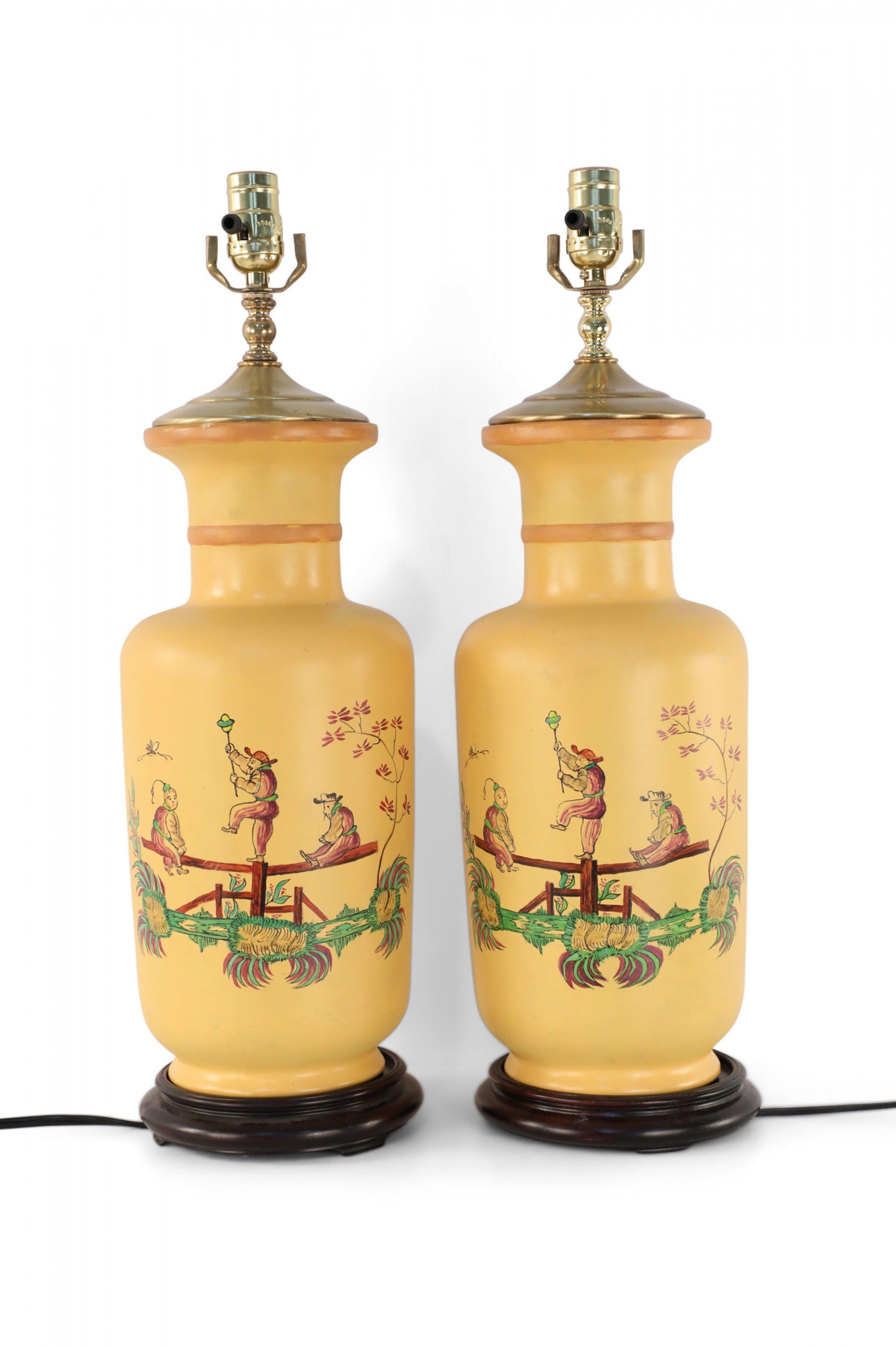 20th Century Pair of Chinese Yellow Balancing Scene Table Lamps For Sale