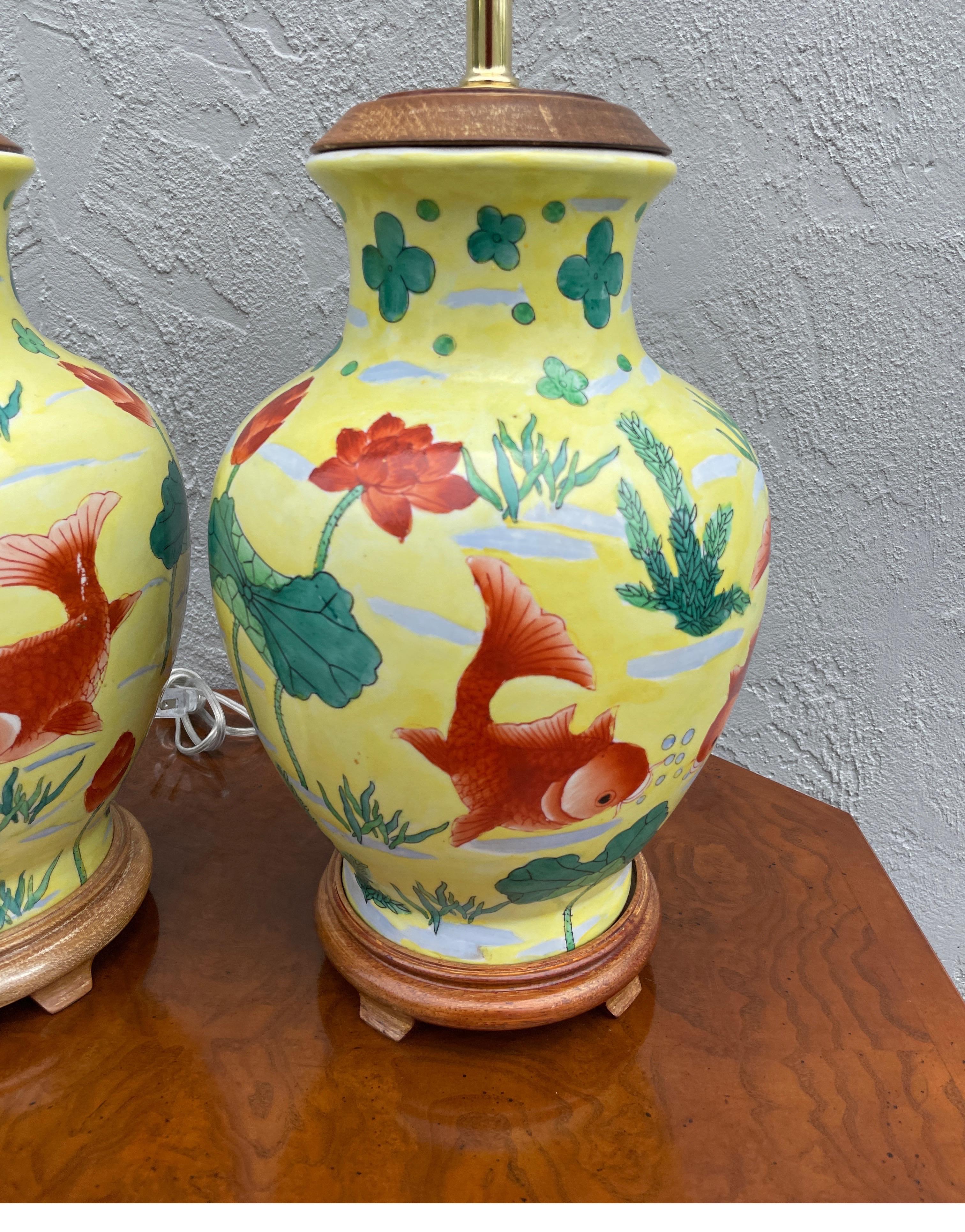 Pair of painted coy fish yellow Chinese ginger jar lamps.