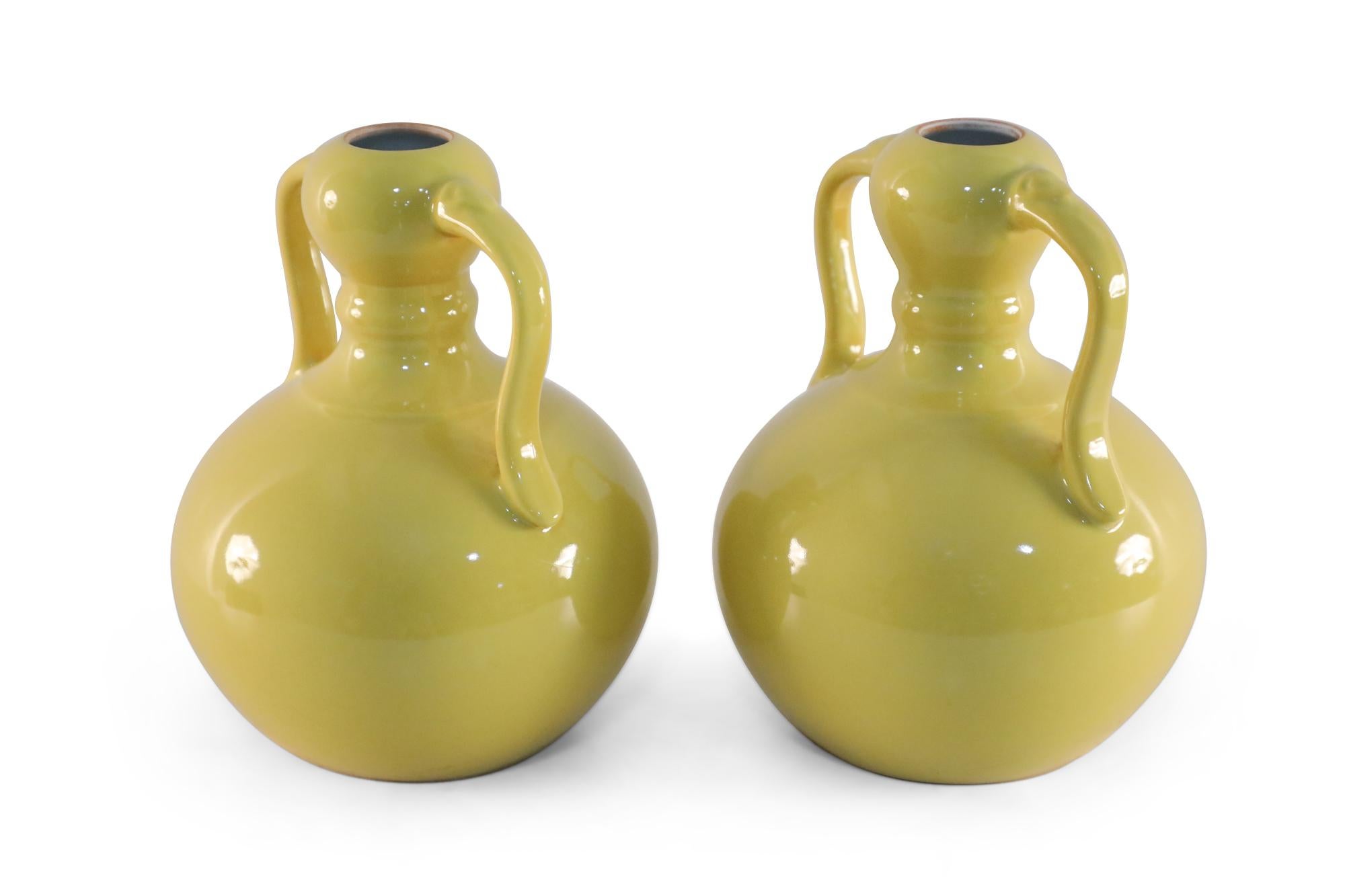 Pair of Antique Chinese (Late 19th Century) yellow porcelain vases with gourd forms and handles (date mark on bottom, see photos).