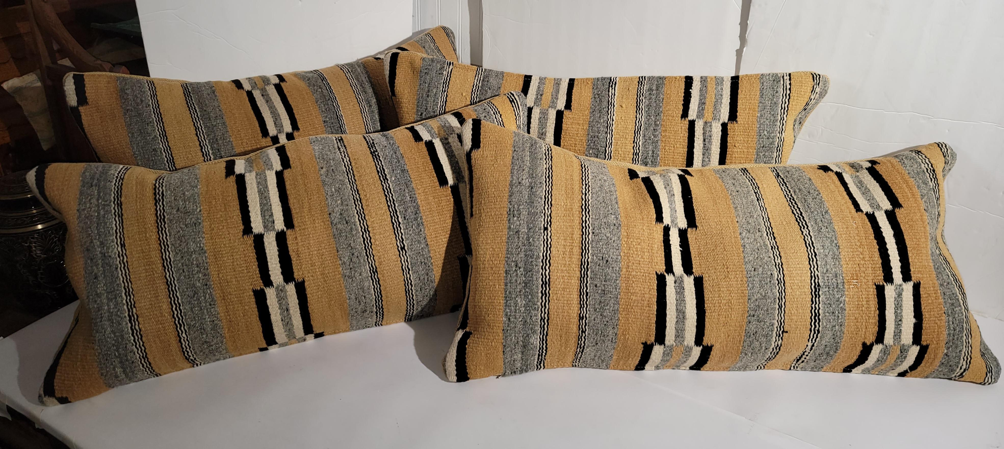 Amazing pairs of Navajo Indian weaving pillows in fine condition. These Chinle weaving's are in fine condition and have yellow linen backings. Sold in pairs.