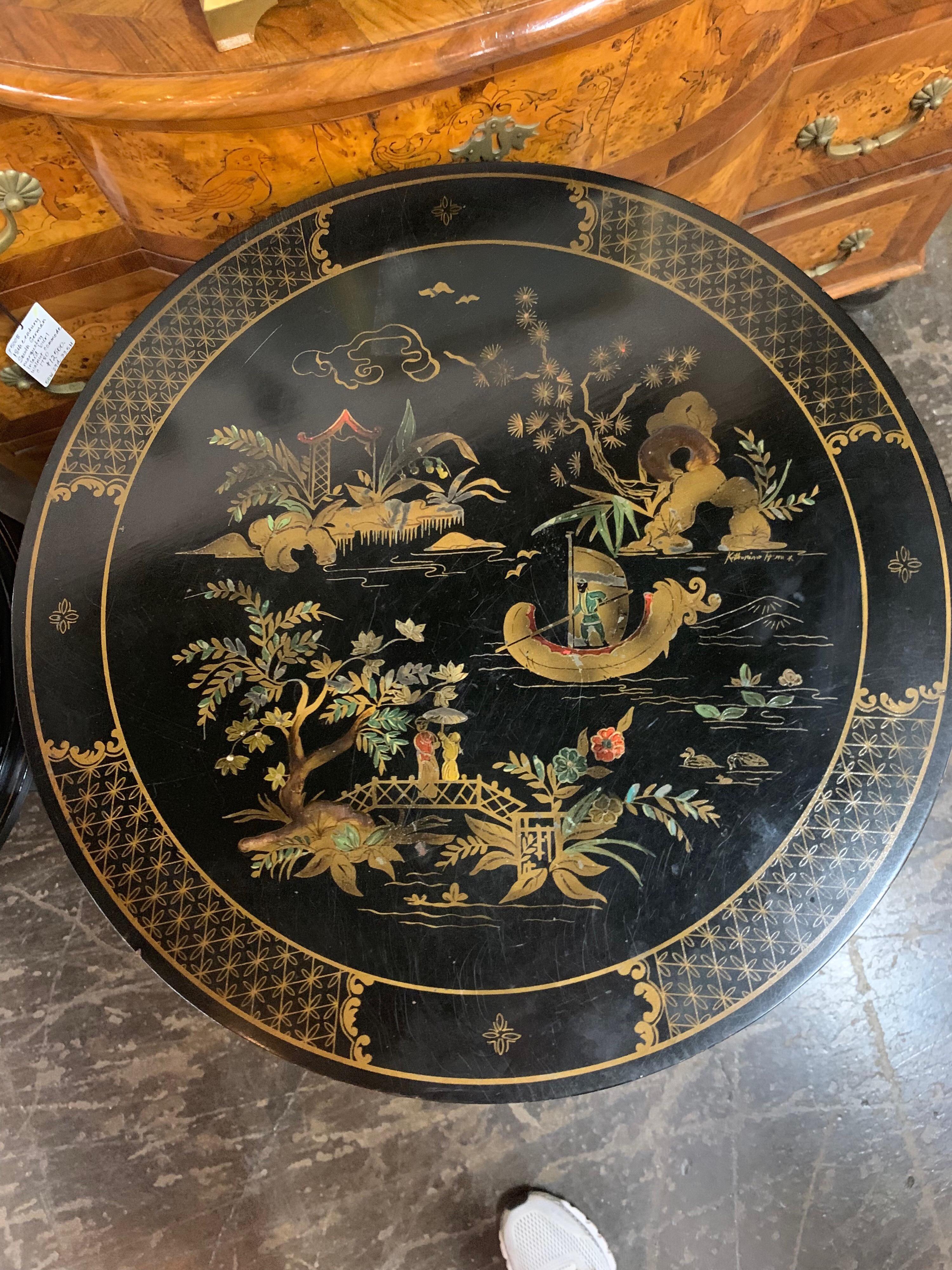 Beautiful pair of black lacquered side tables with interesting hand painted Chinoiserie designs on the top and second tier of the table. The sides of the table are made of wire mesh. Great conversation pieces!