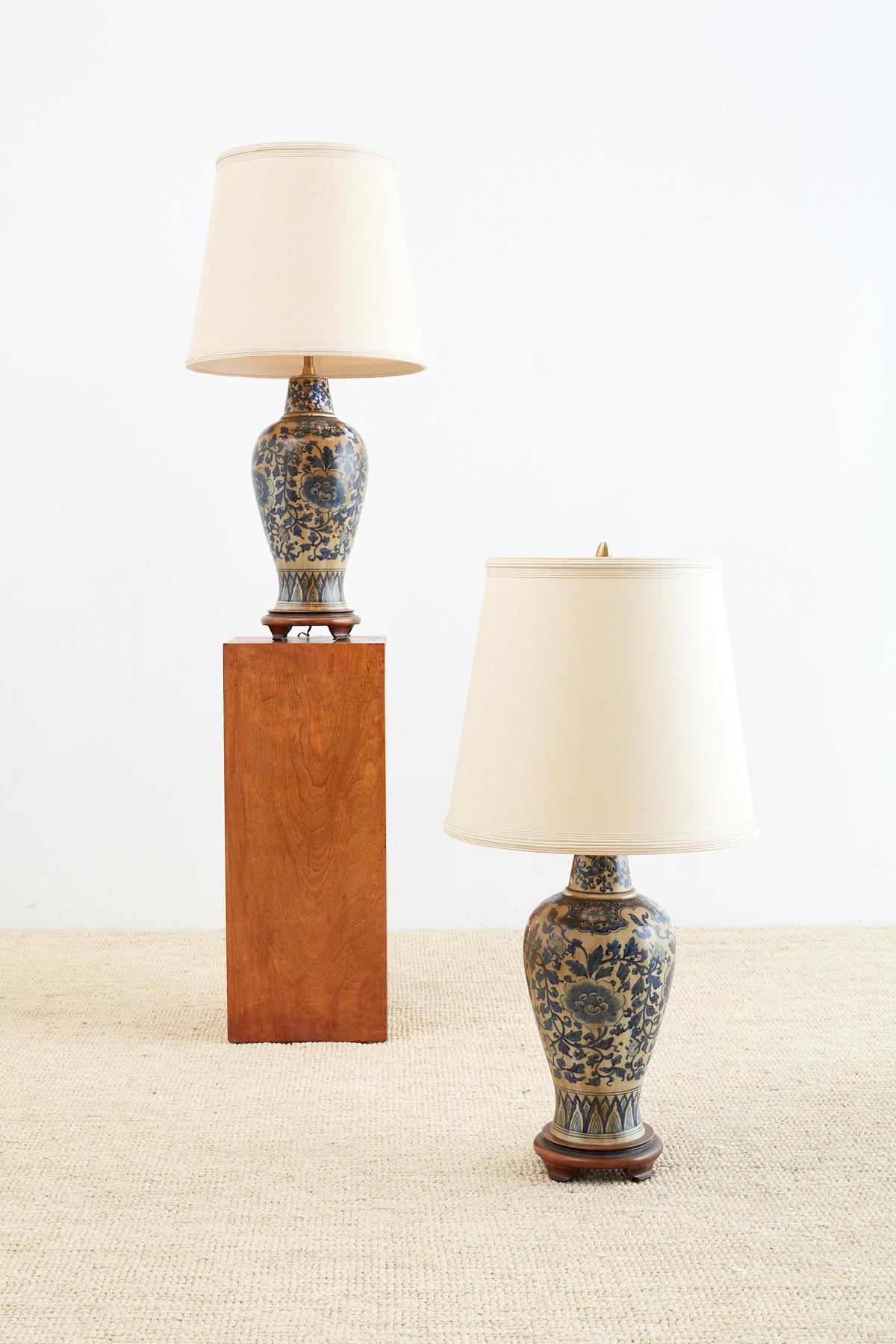 Fantastic Hollywood Regency period pair of blue and white porcelain chinoiserie vase table lamps by Marbro Lamp Co. Features a pair of Asian style jar form vases with an antique finish that can be removed for a modern look or lightened for a