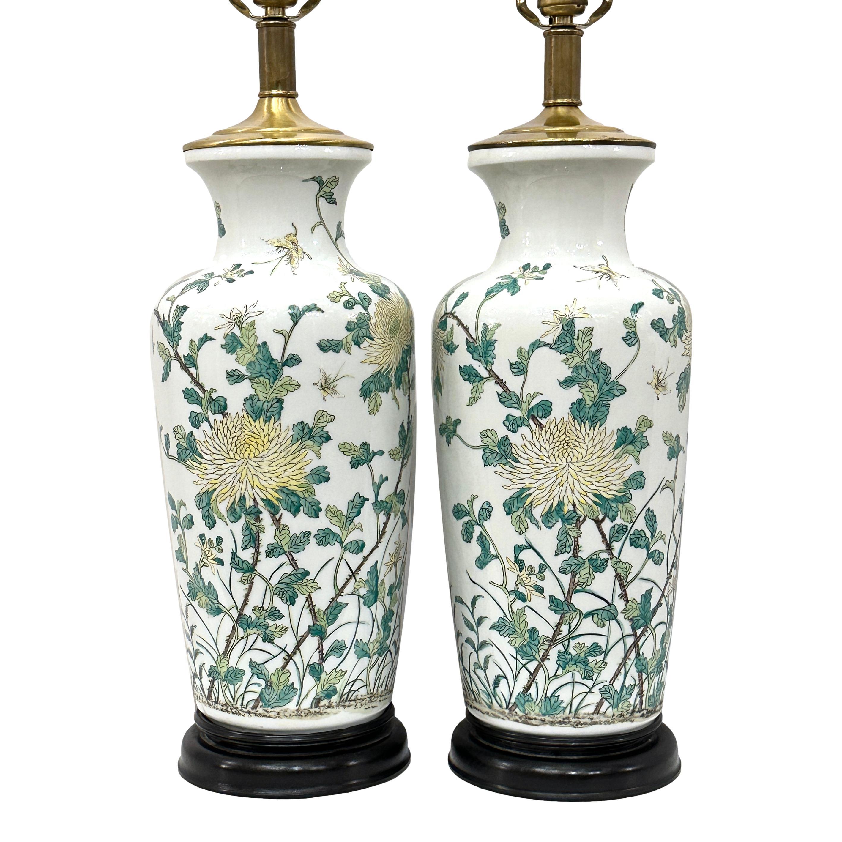 Pair of circa 1960's Chinese porcelain lamps with floral motif.

Measurements:
Height of body: 20
