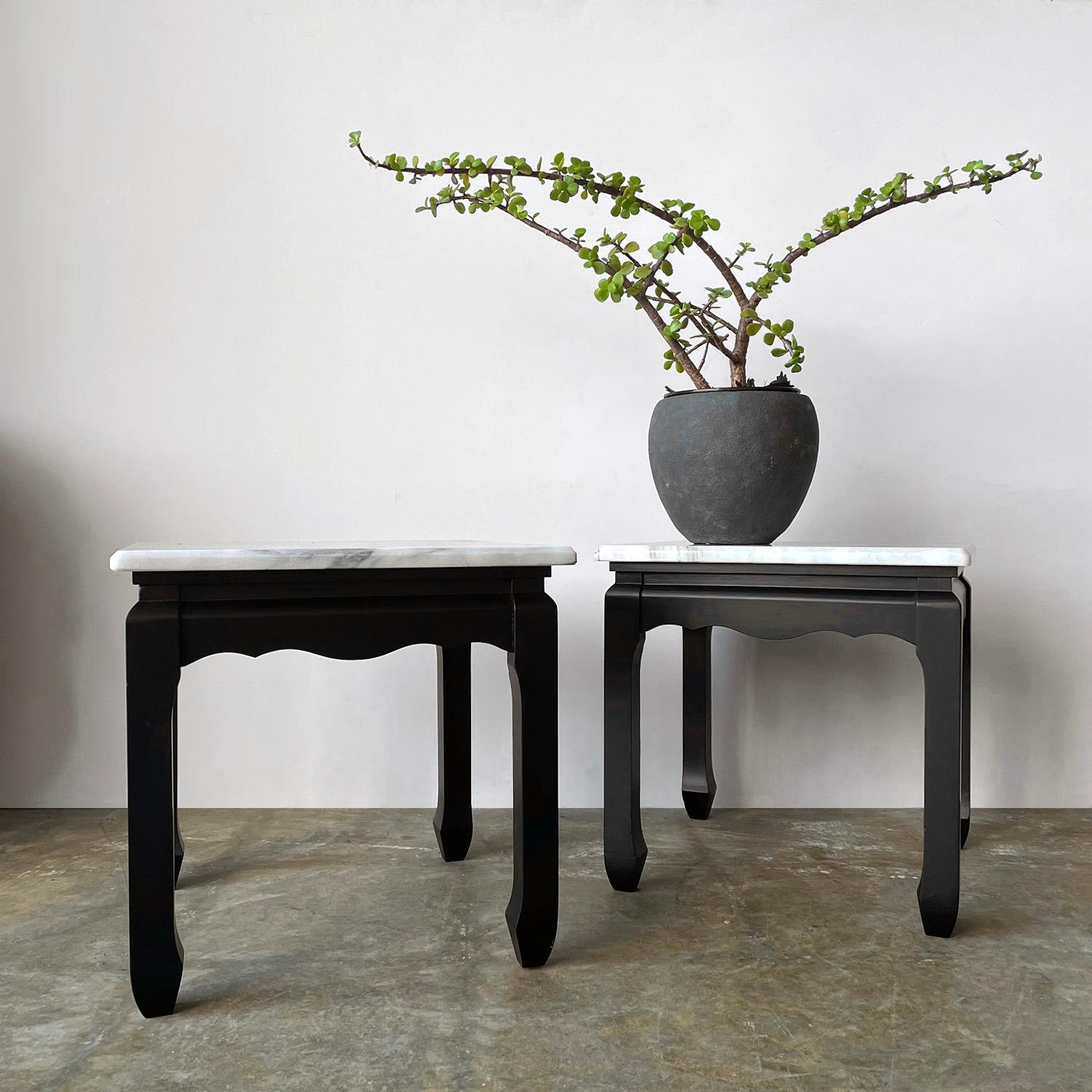 Pair of Chinoiserie Marble Side End Tables 
Beautifully carved wood bases
Marble has light surface markings and one top has a few light scratches
Patina from age and use
Sold as a pair

