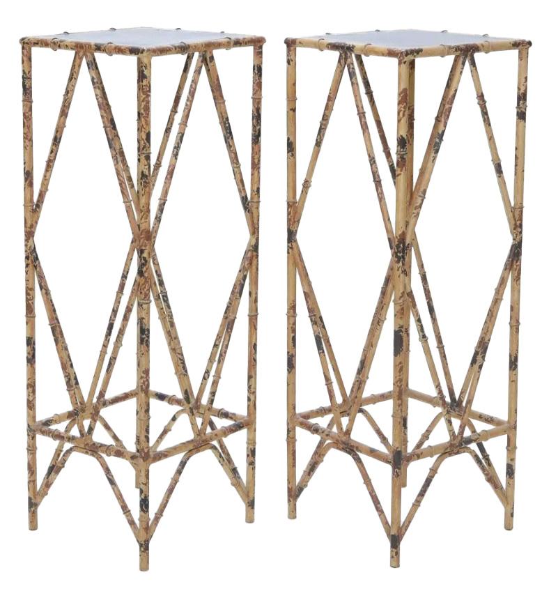 Elevate your home decor with this exquisite pair of Chinoiserie-style metal plant stands, meticulously crafted to evoke the timeless elegance of bamboo. With their slender, bamboo-like frames, these stands blend the enduring appeal of traditional